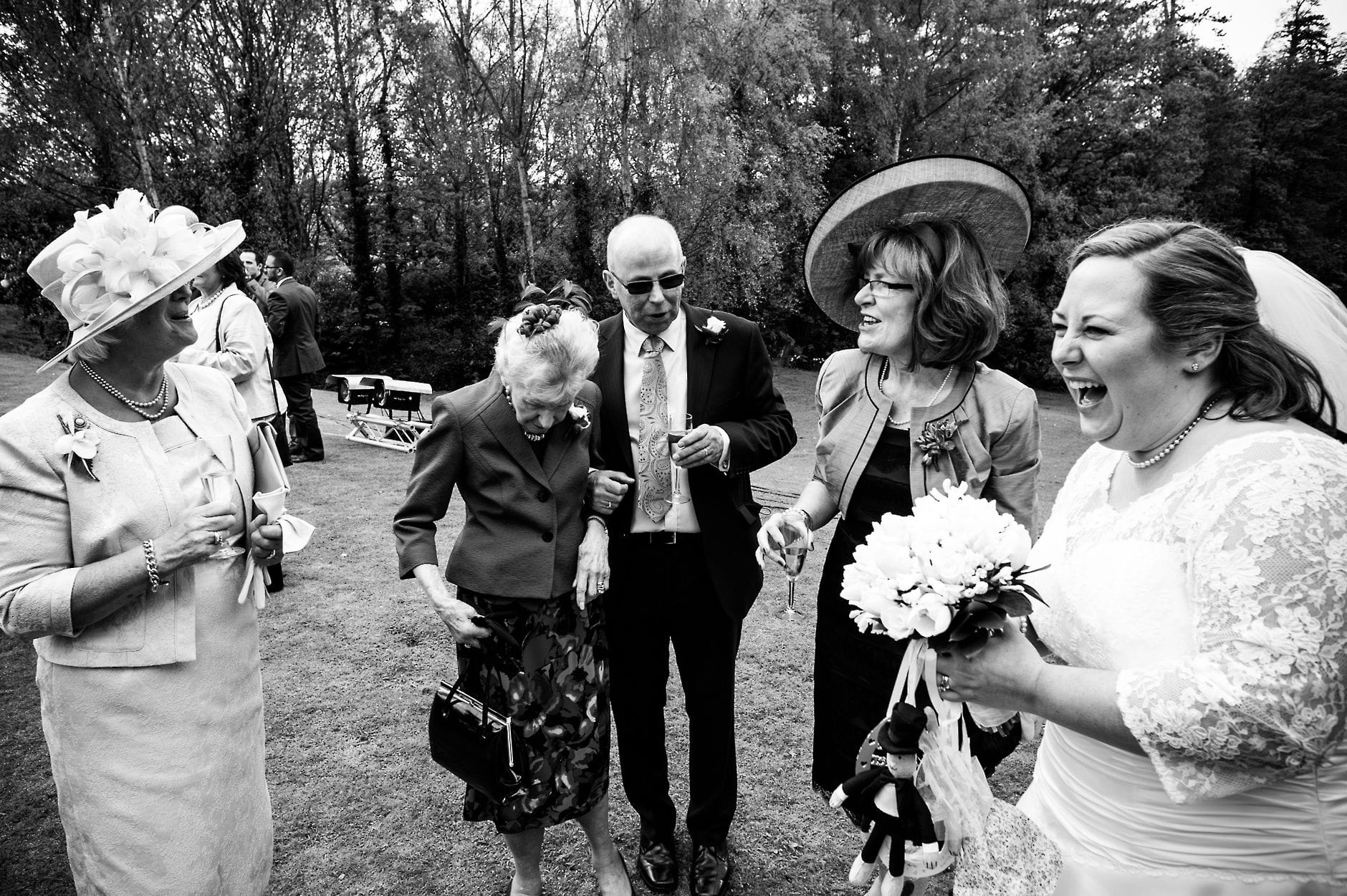 An English Village Wedding in Melbourne Derbyshire sharing a joke during a wedding