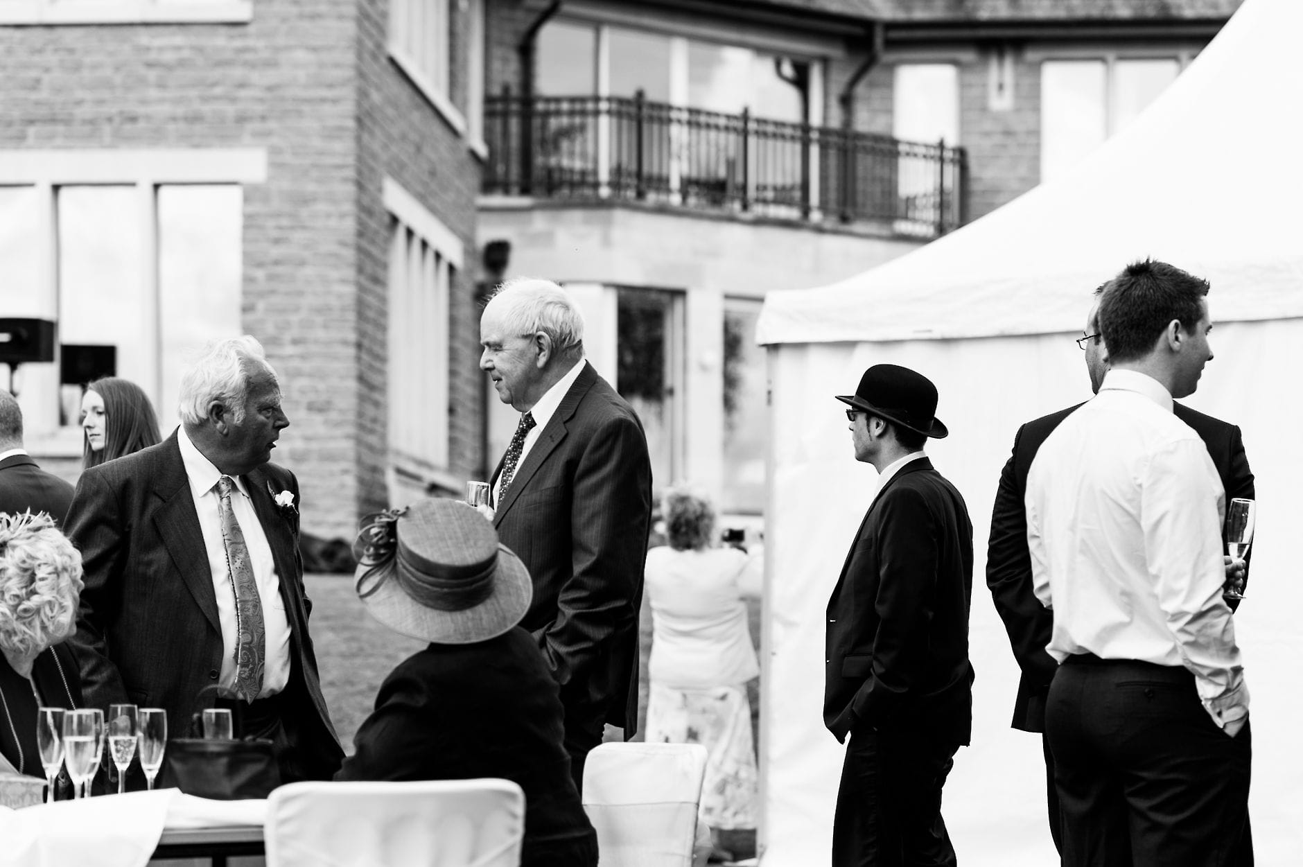 An English Village Wedding in Melbourne Derbyshire man in bowler hat at a wedding