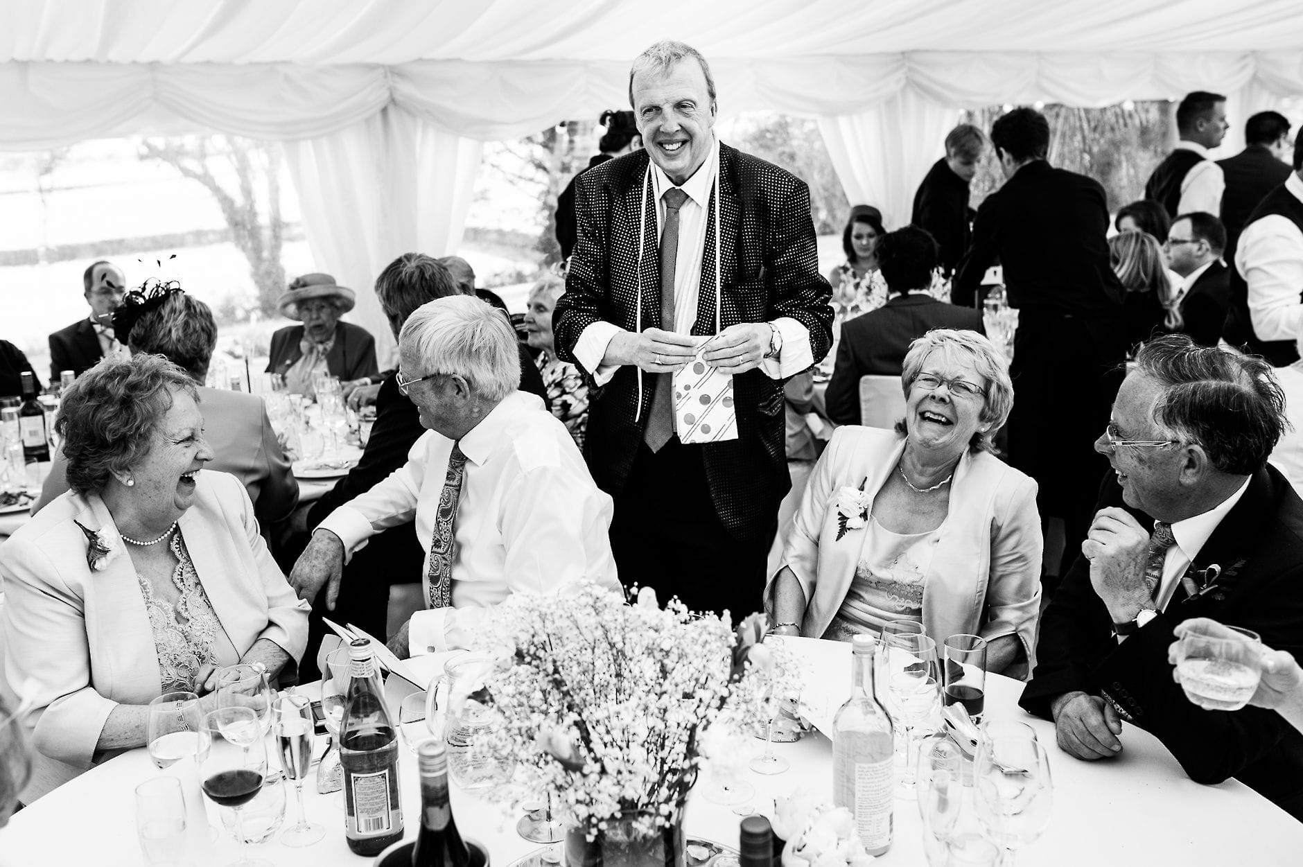 An English Village Wedding in Melbourne Derbyshire wedding magician making guests laugh