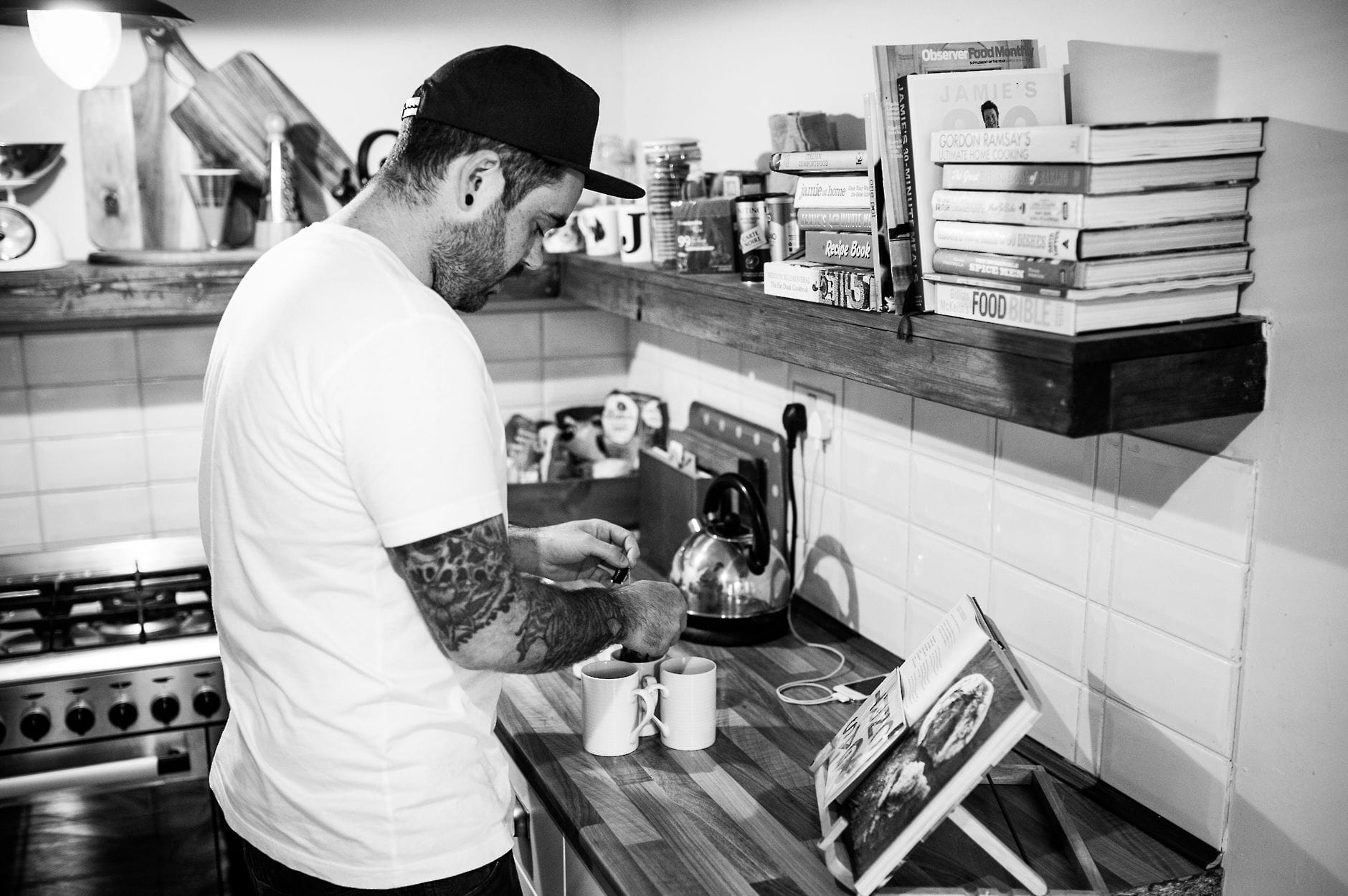 tattooed groom making cup of tea wedding morning
