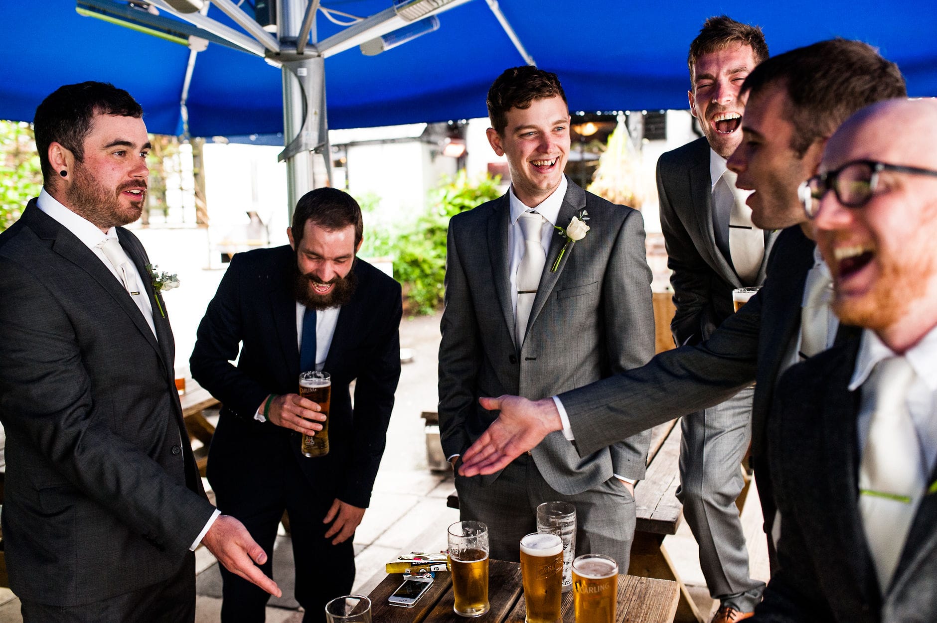 groomsmen laughing before the wedding