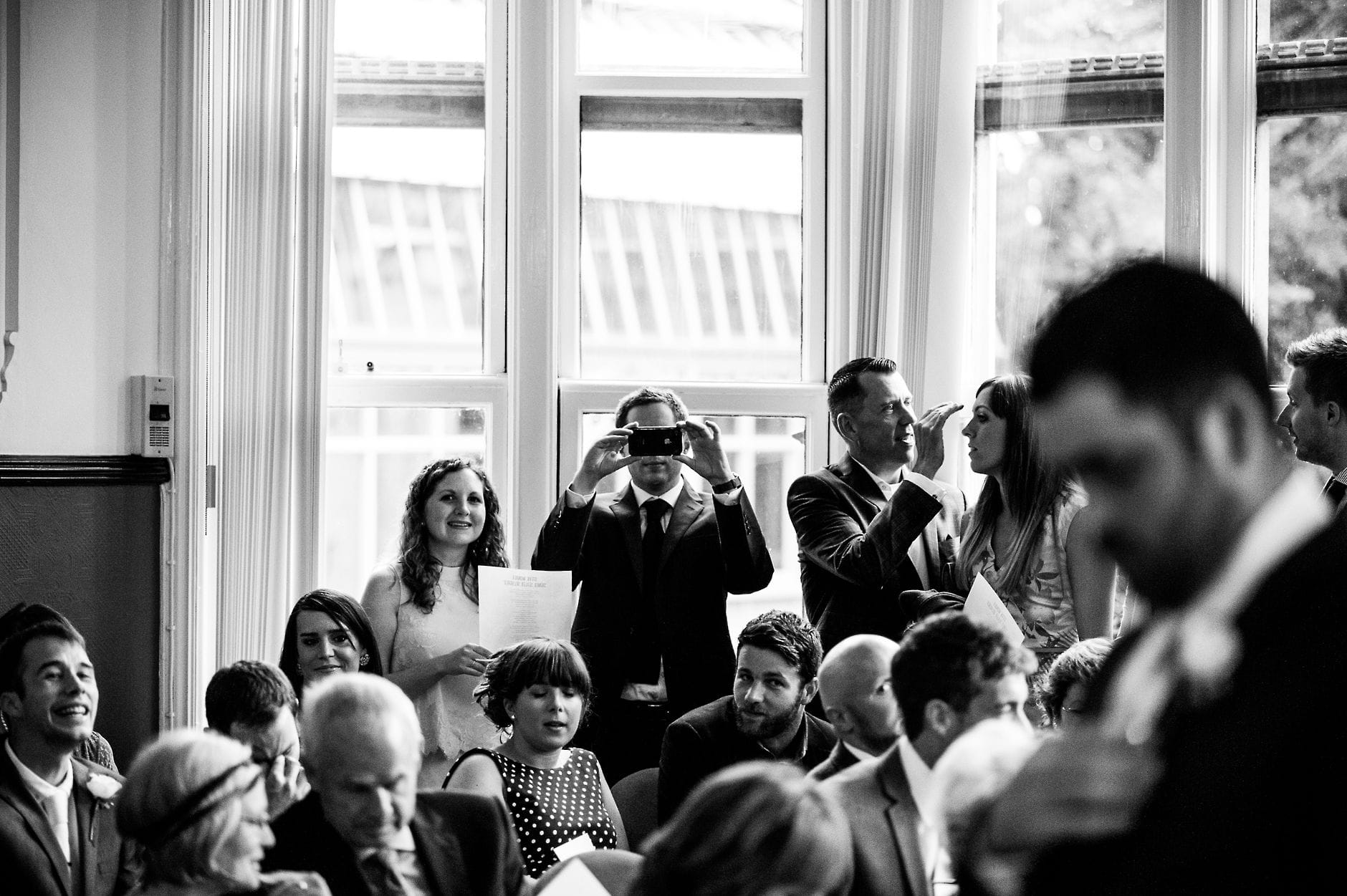 taking phone photos at a wedding