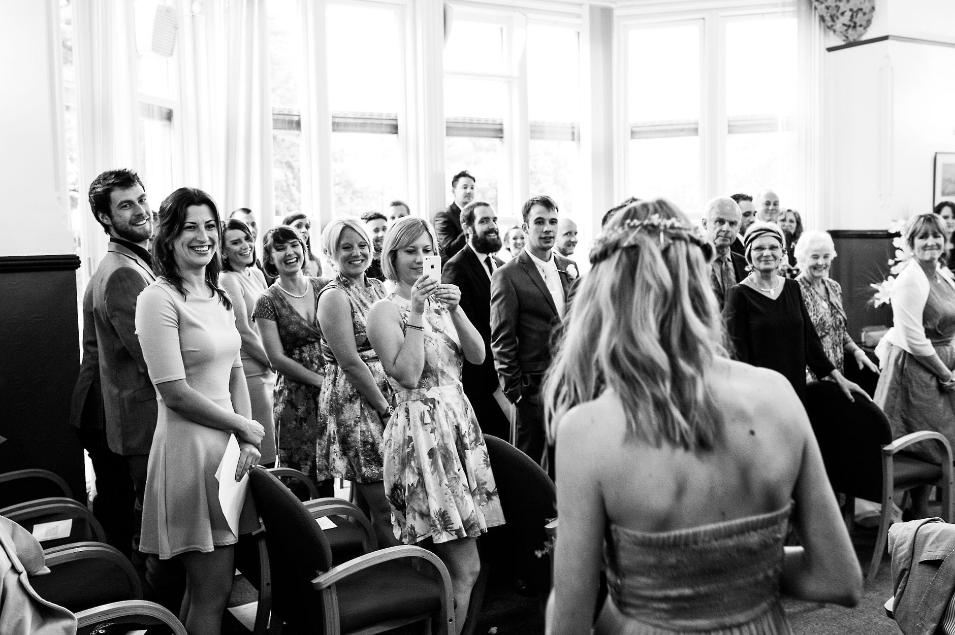 taking photos of bride arriving