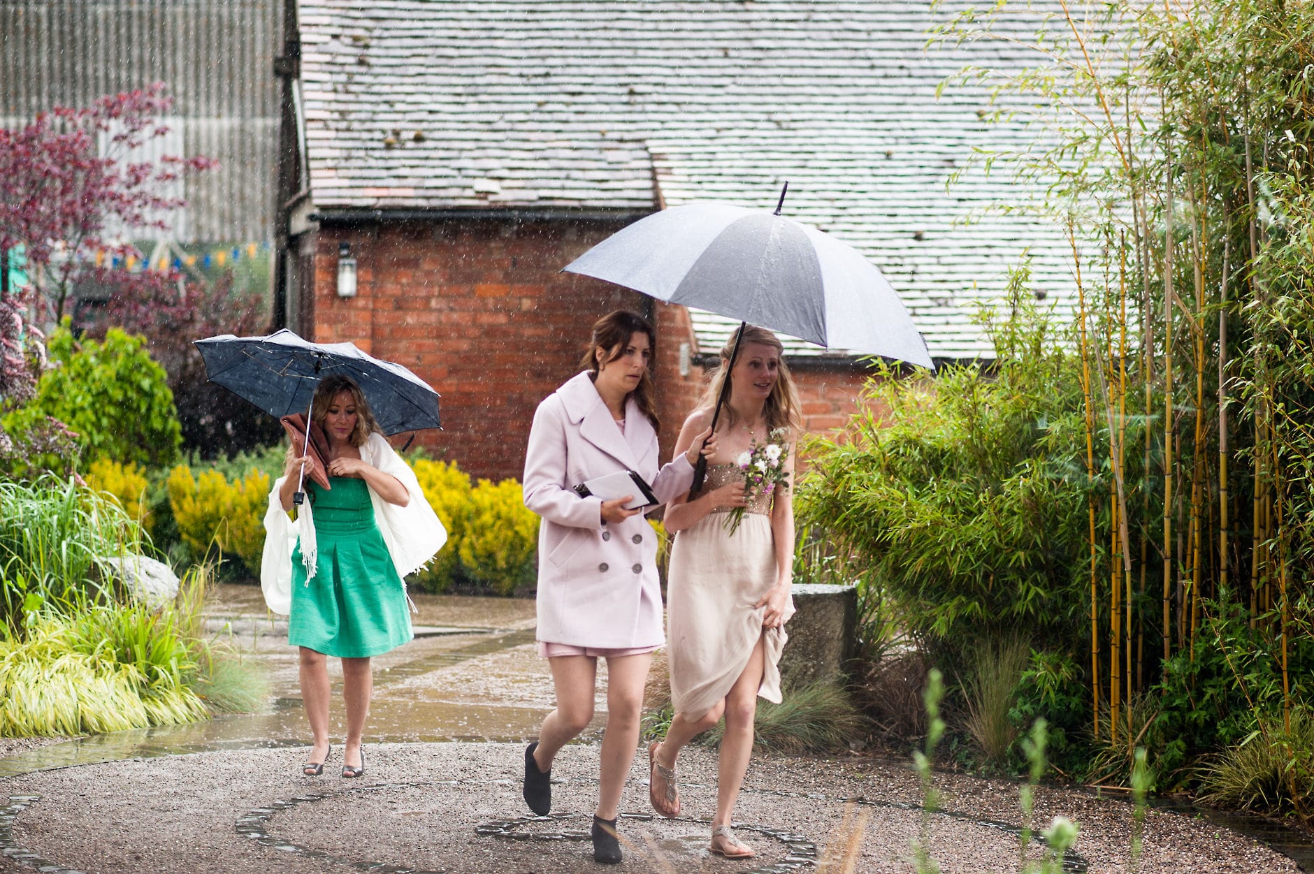 wedding guests arriving in the rain