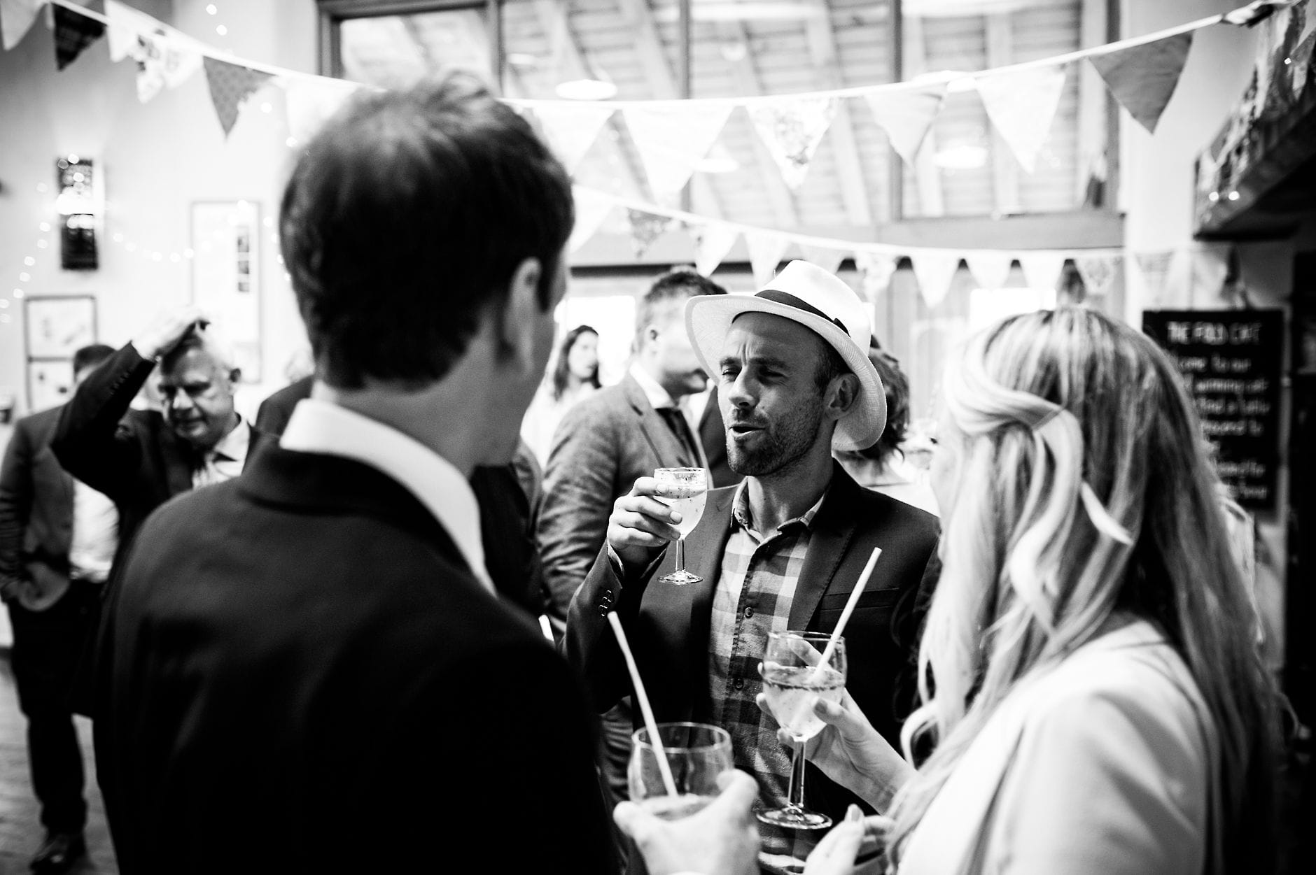 man at a wedding in ladies hat