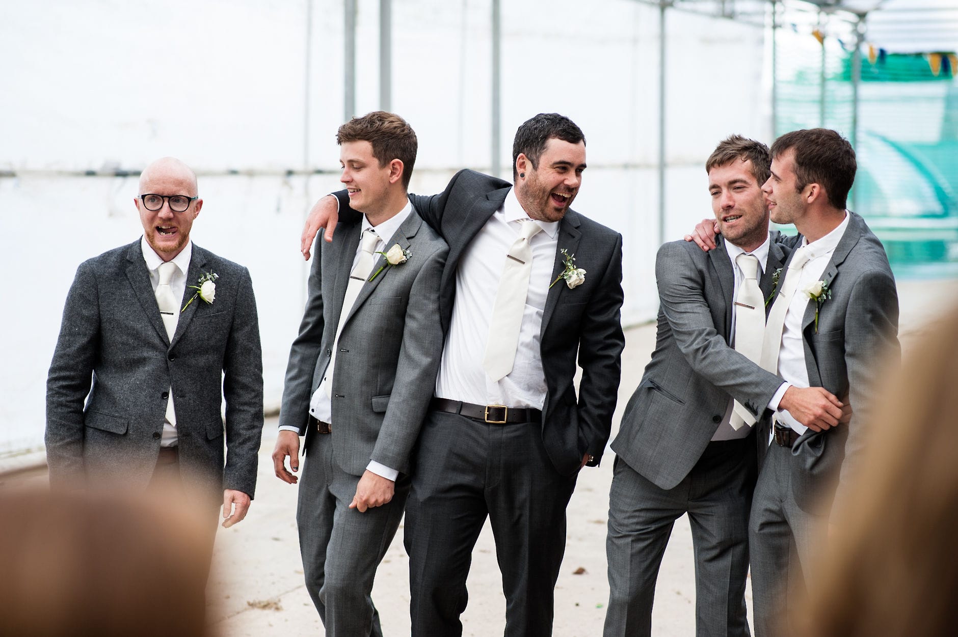 groom hanging out with groomsmen