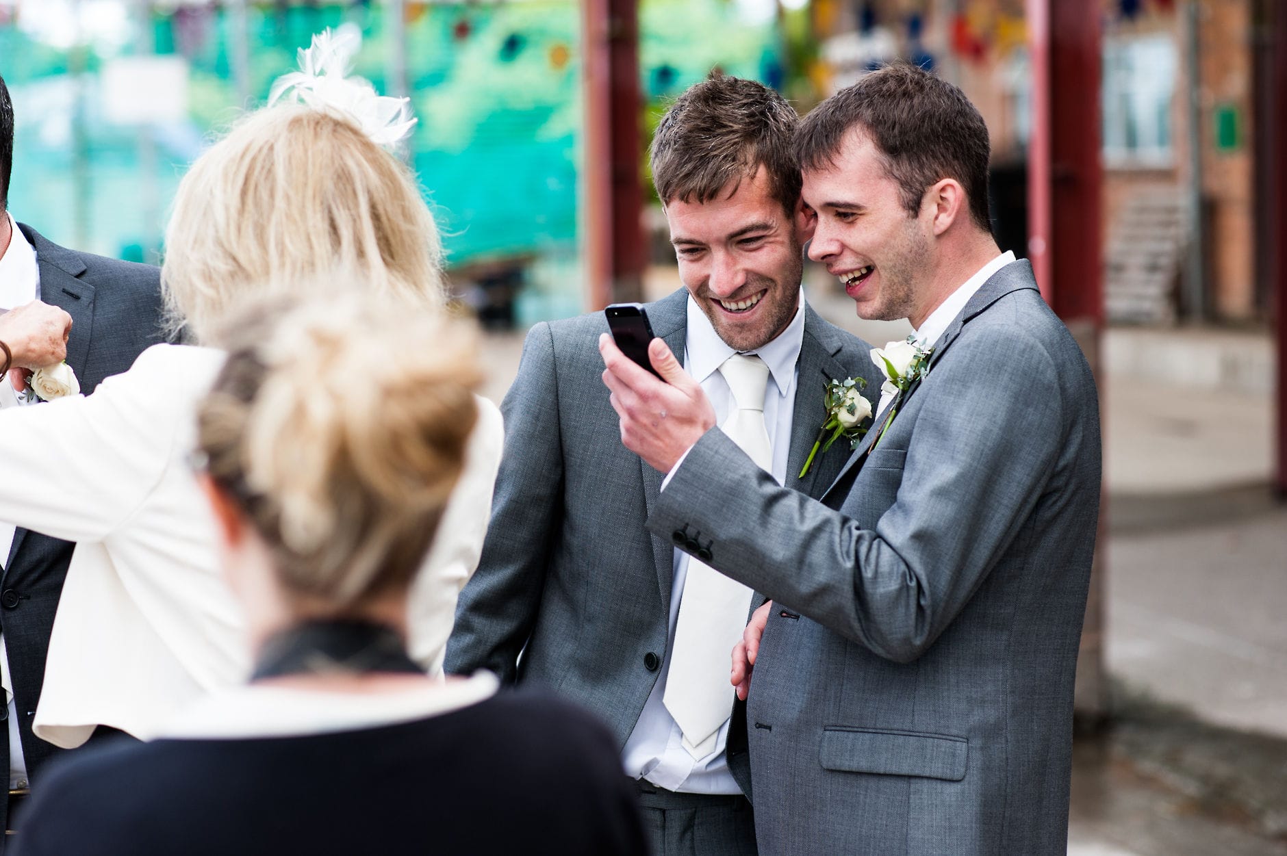 groomsmen looking at phone