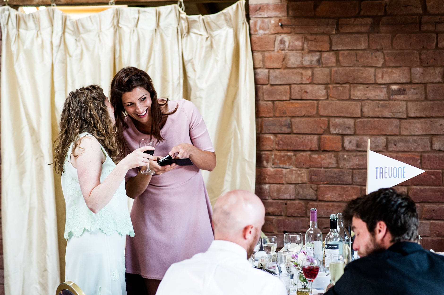 wedding guests sharing a joke