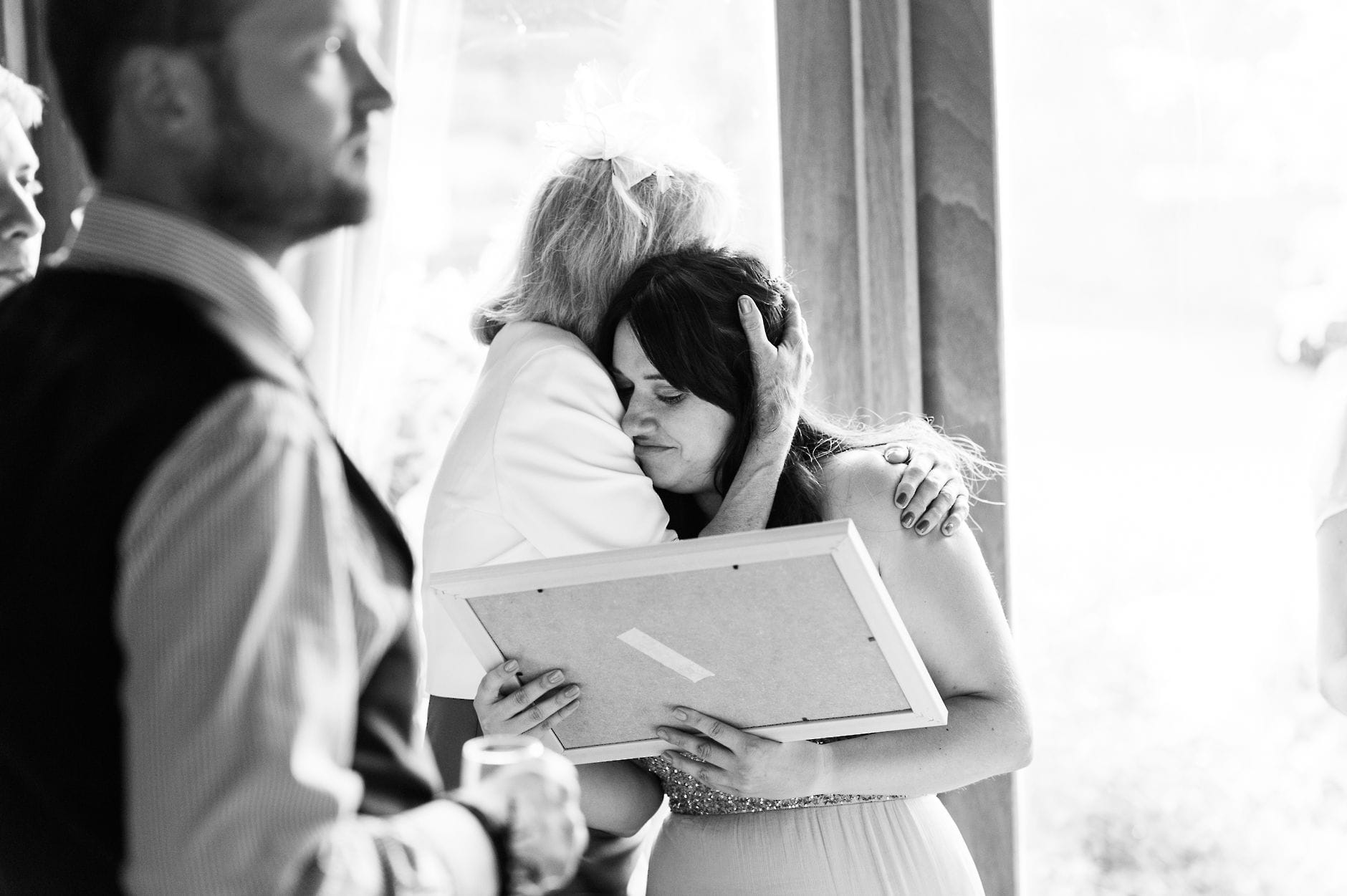emotional hug after wedding speeches