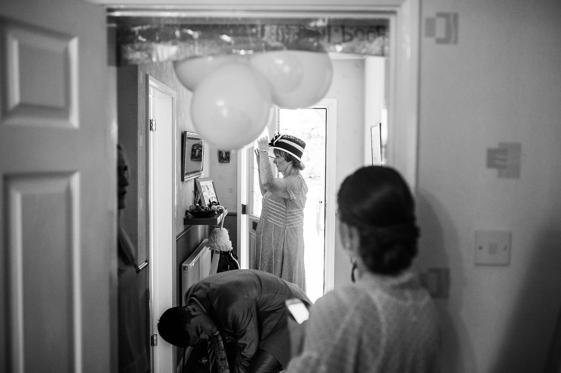 Grandma putting on her wedding hat