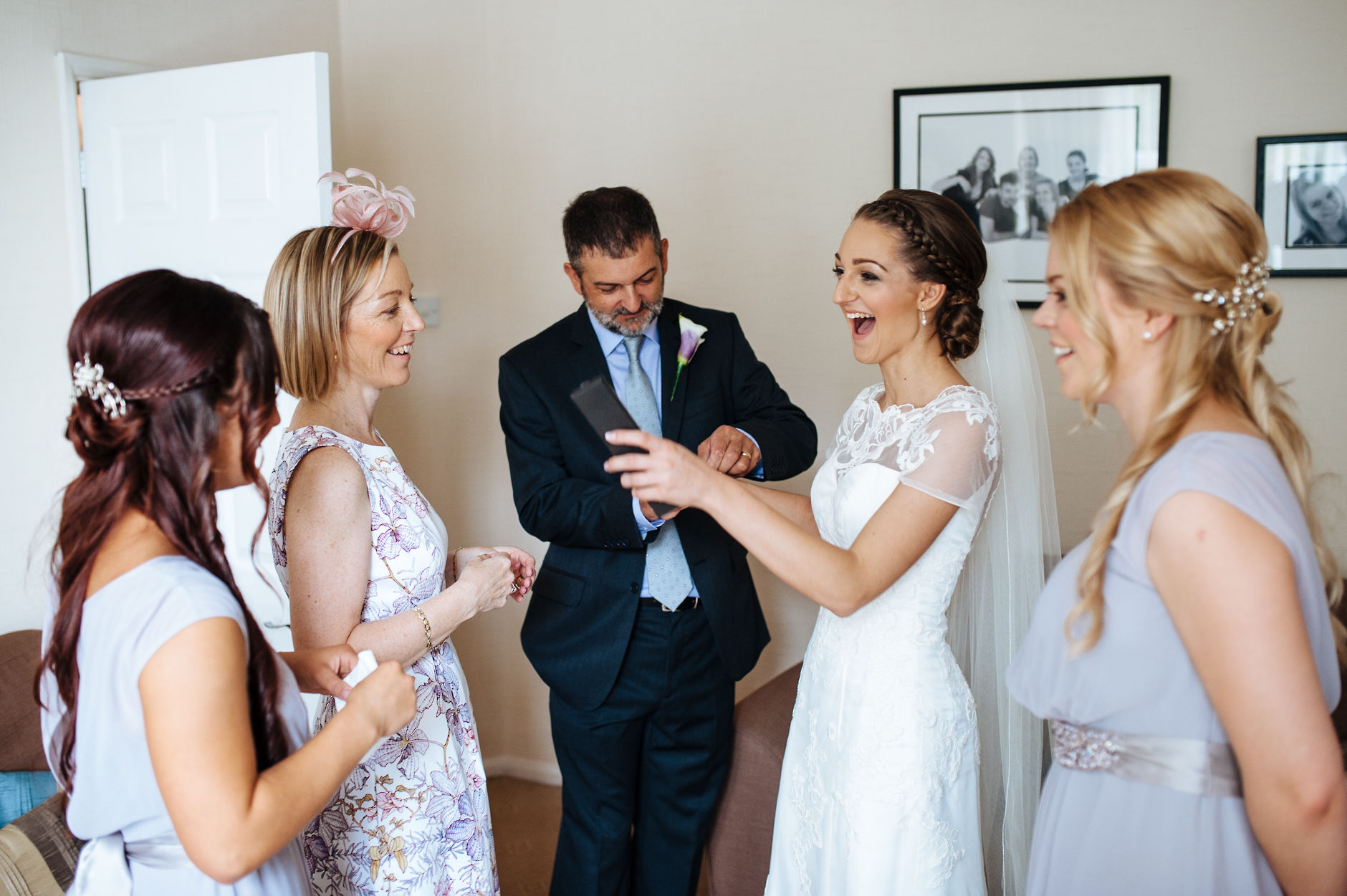 Bride laughing with her family