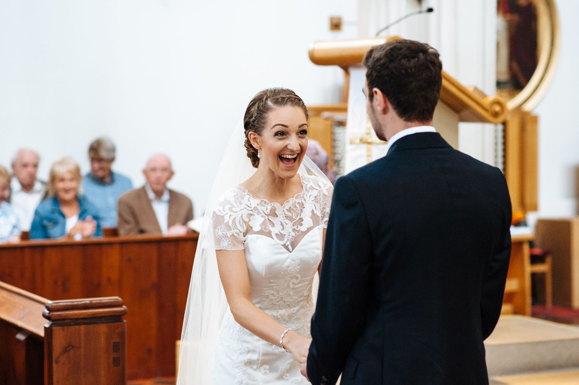 Bride laughing in church