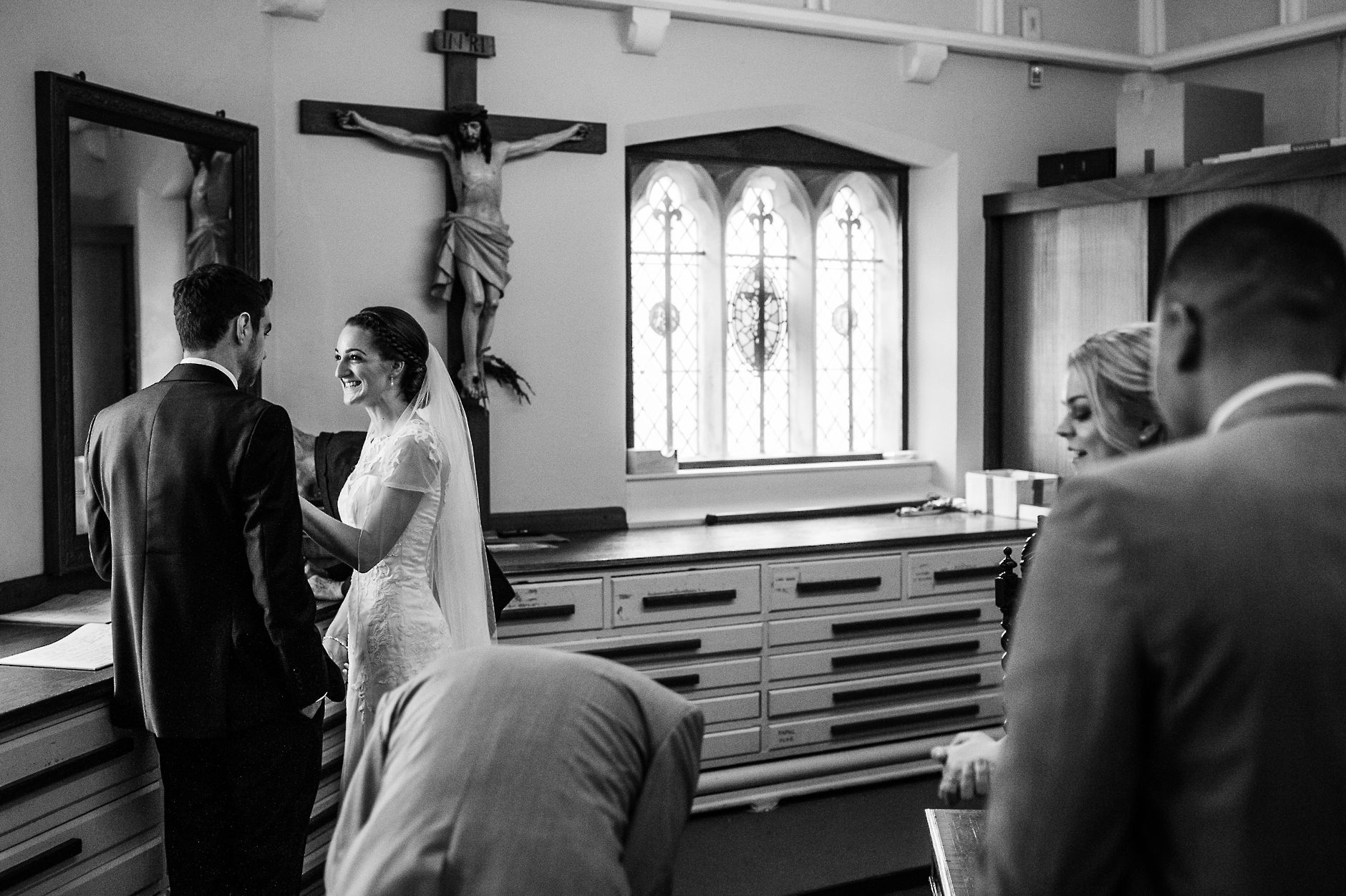 Bride and groom in the back of the church