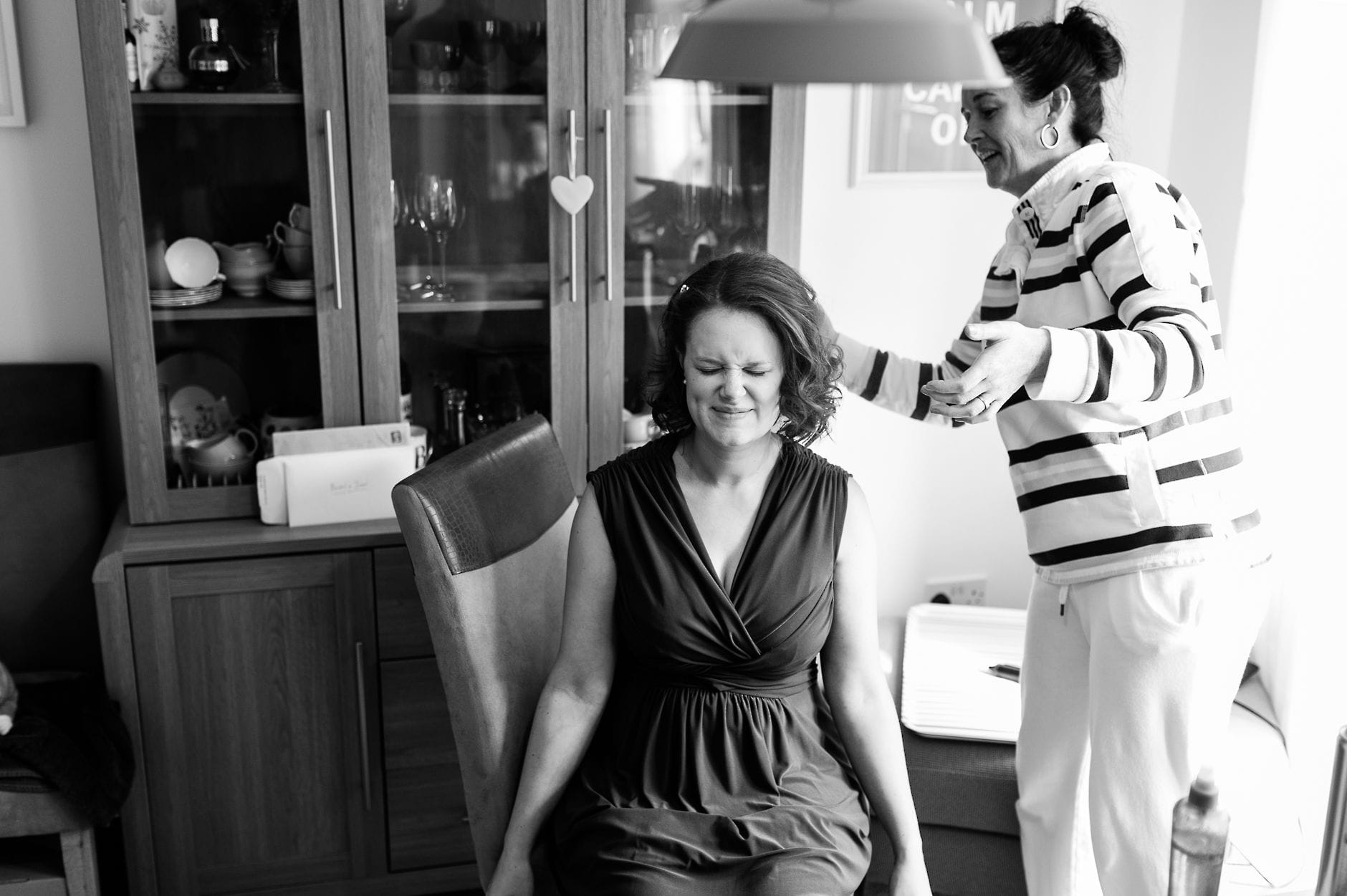 bridesmaid having hair styled