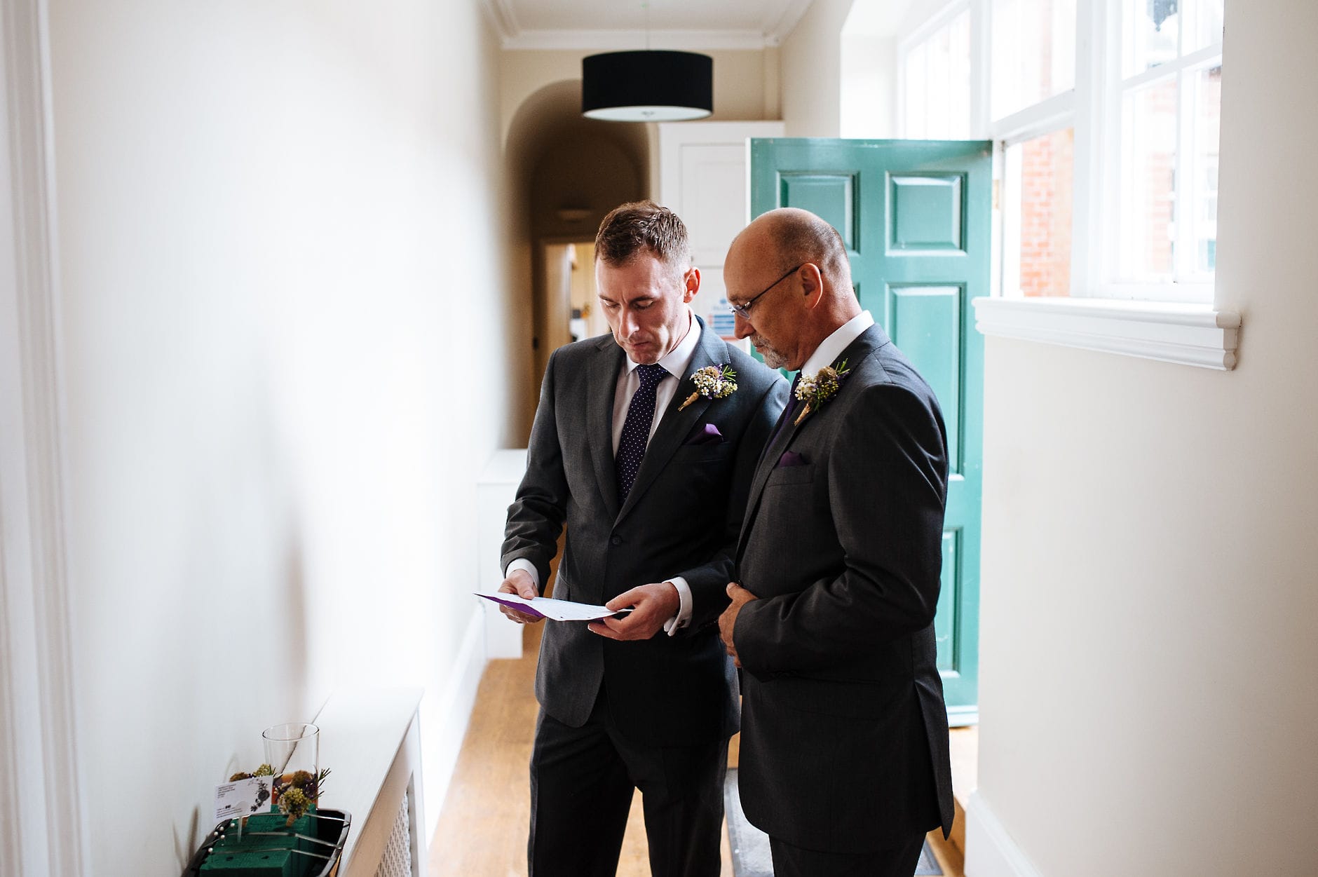 Groom working on speech with best man