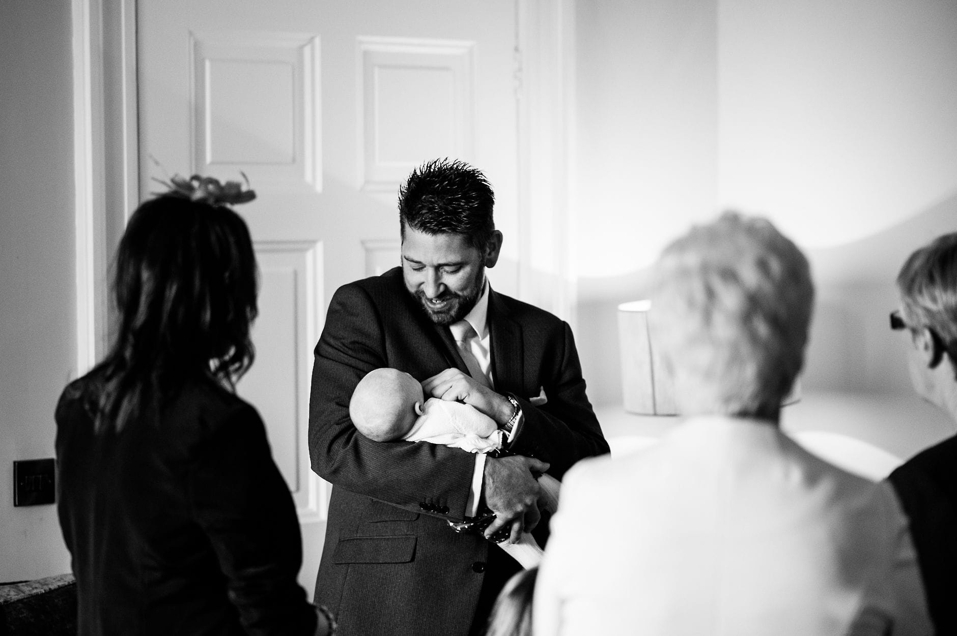 guest holding a little baby