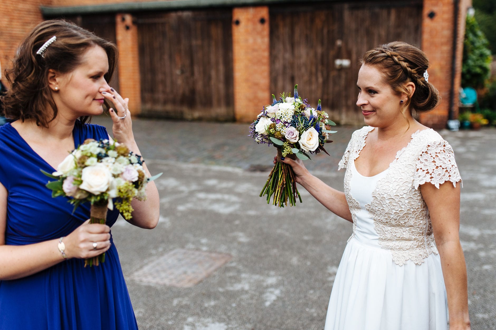 Bride with bridesmaid holding bouquets