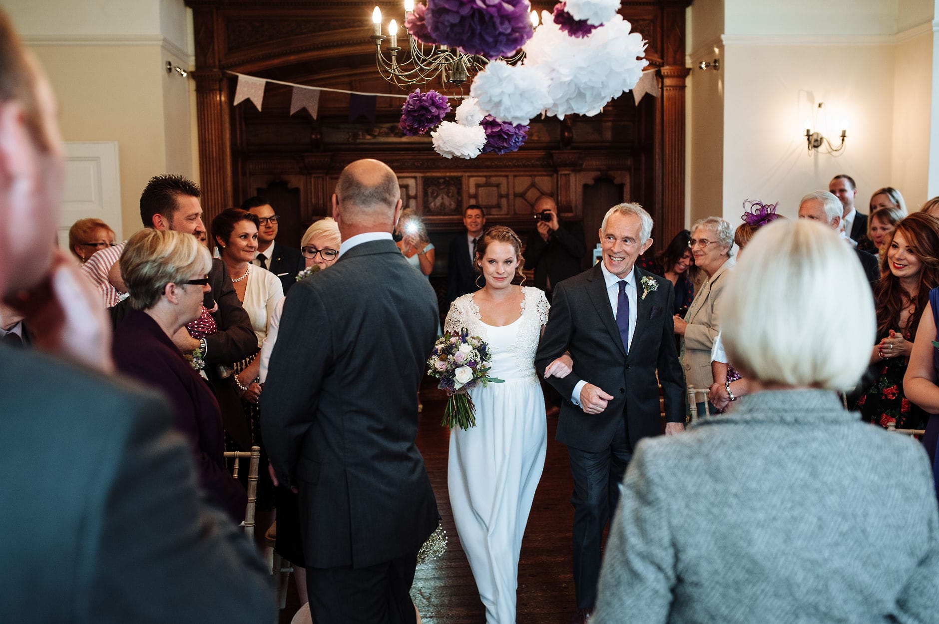 Bride walking down the aisle with her dad