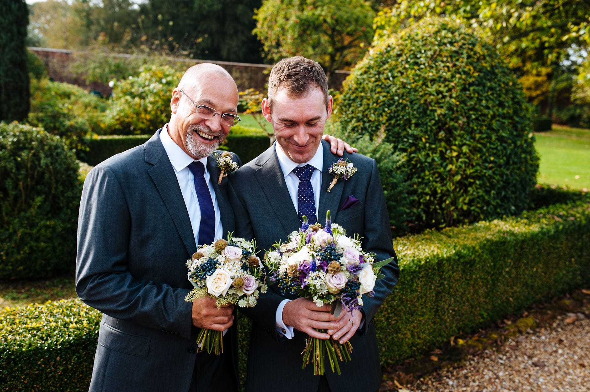 Groom and best man with flowers