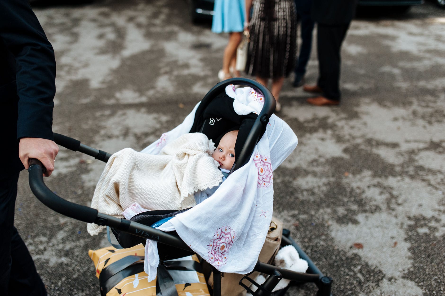 baby in a pram looking at the camera
