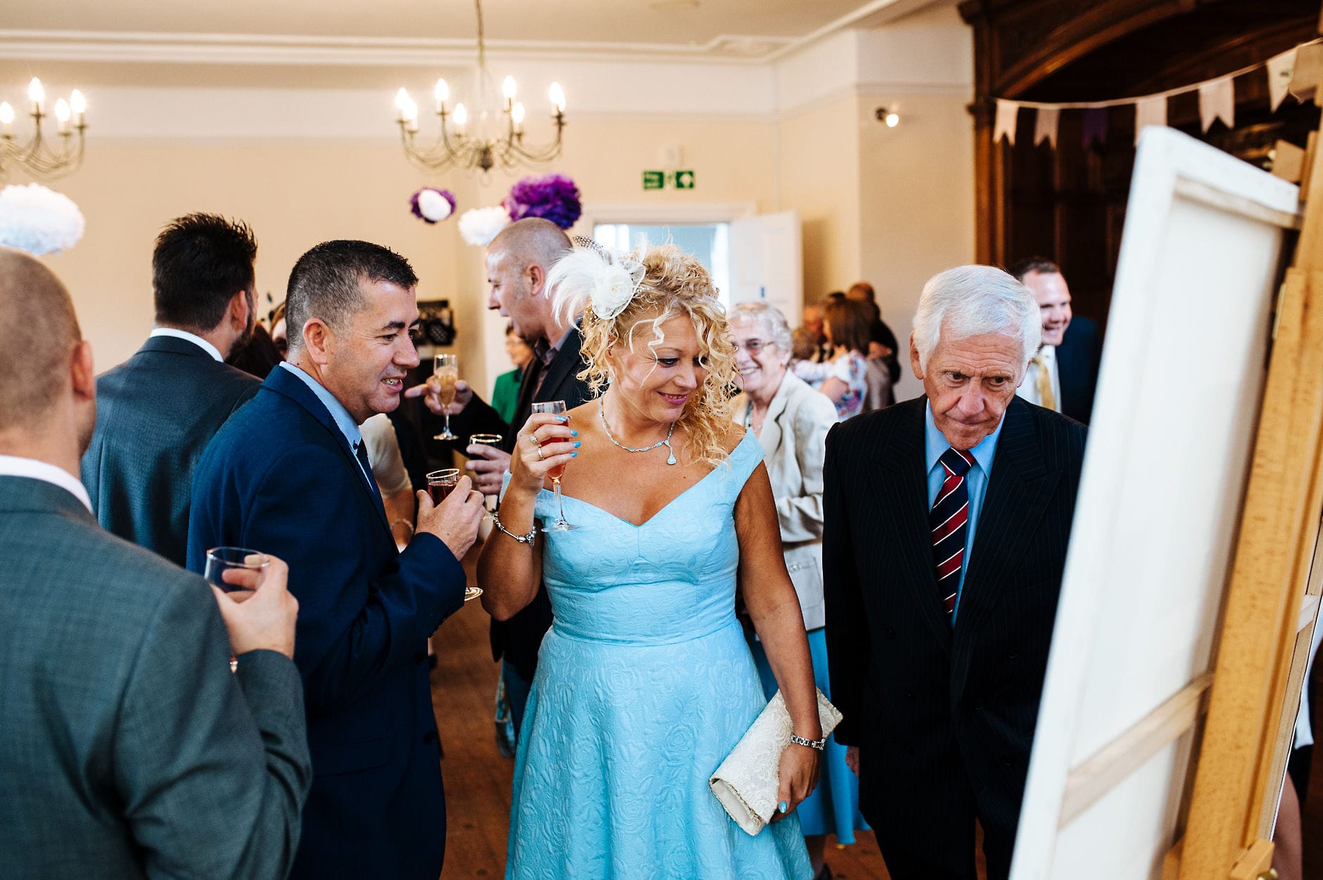 wedding guests studying the seating plan