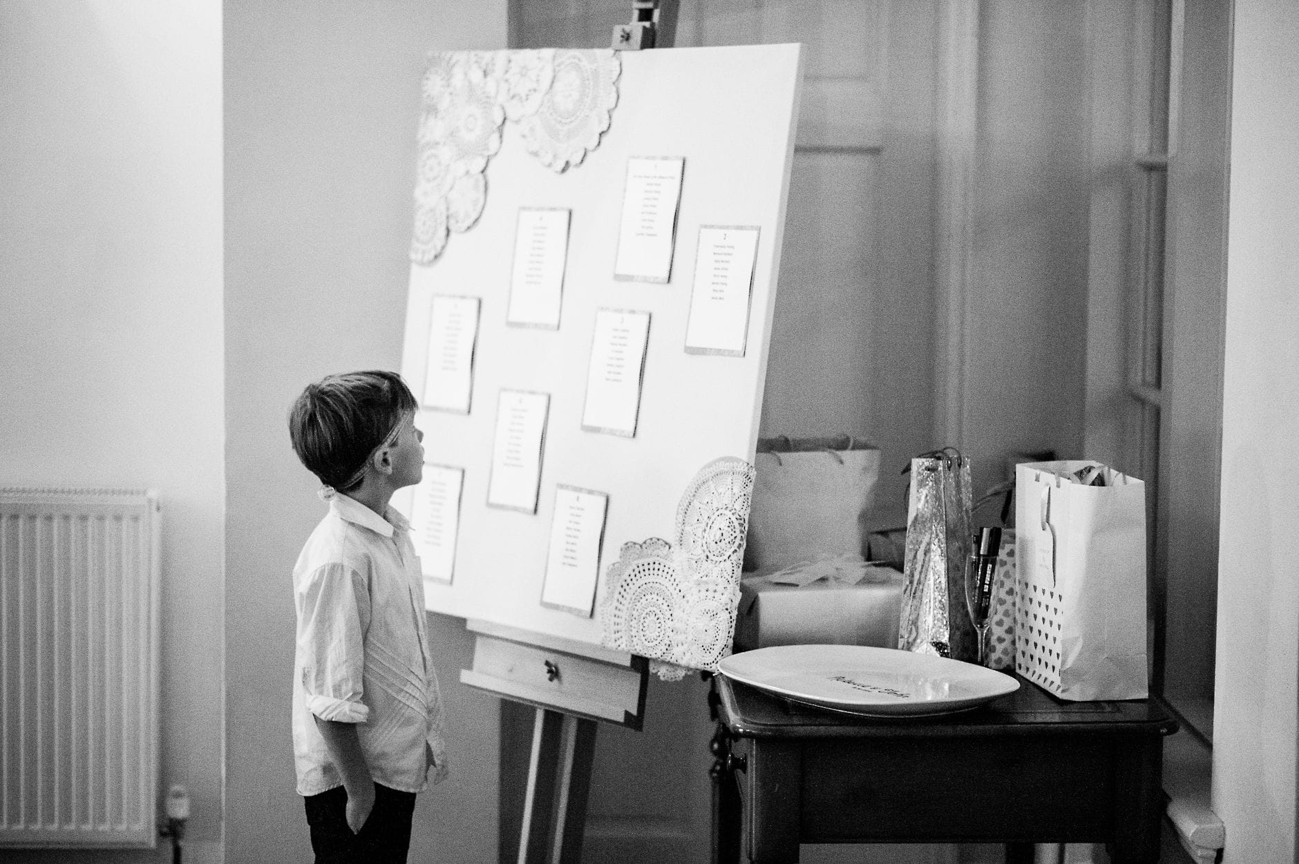 little boy looking at the seating plan