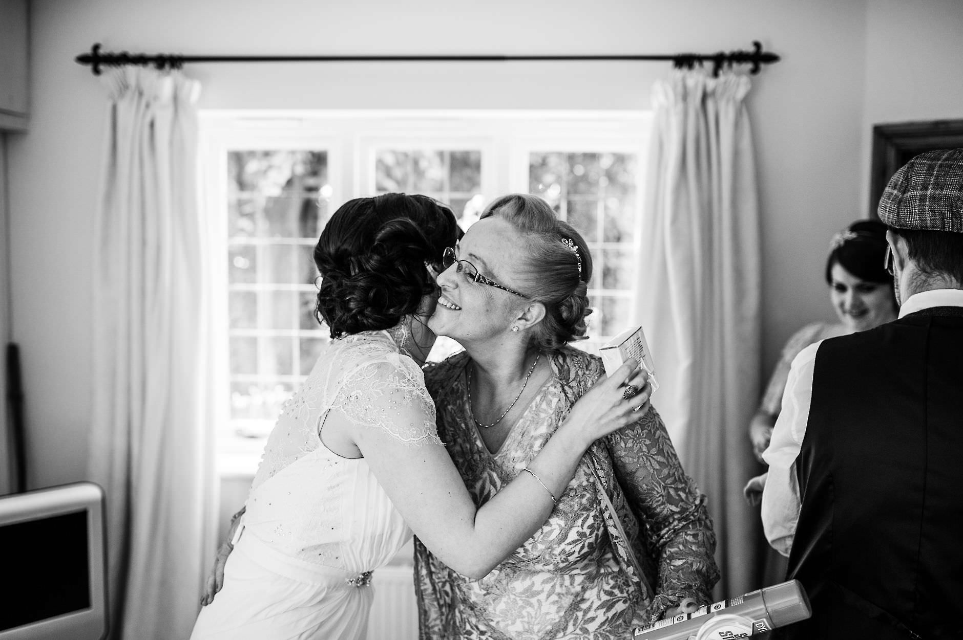 bride kisses her mum