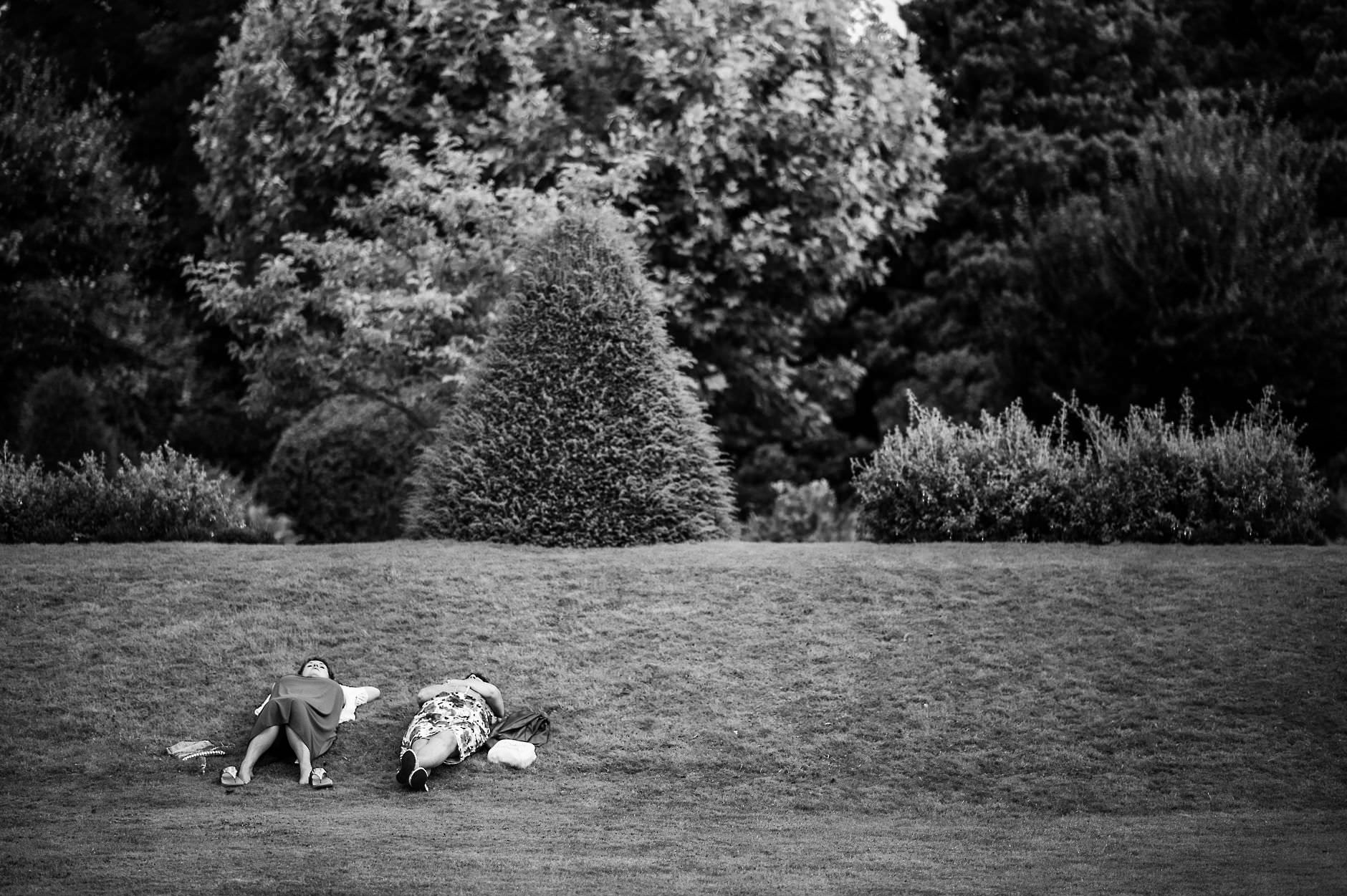 two guests relaxing on the grass