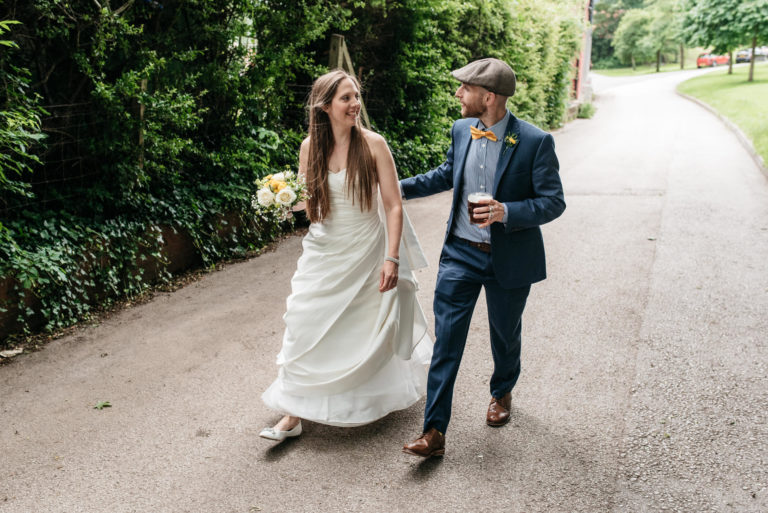 bride and groom walk through darley park