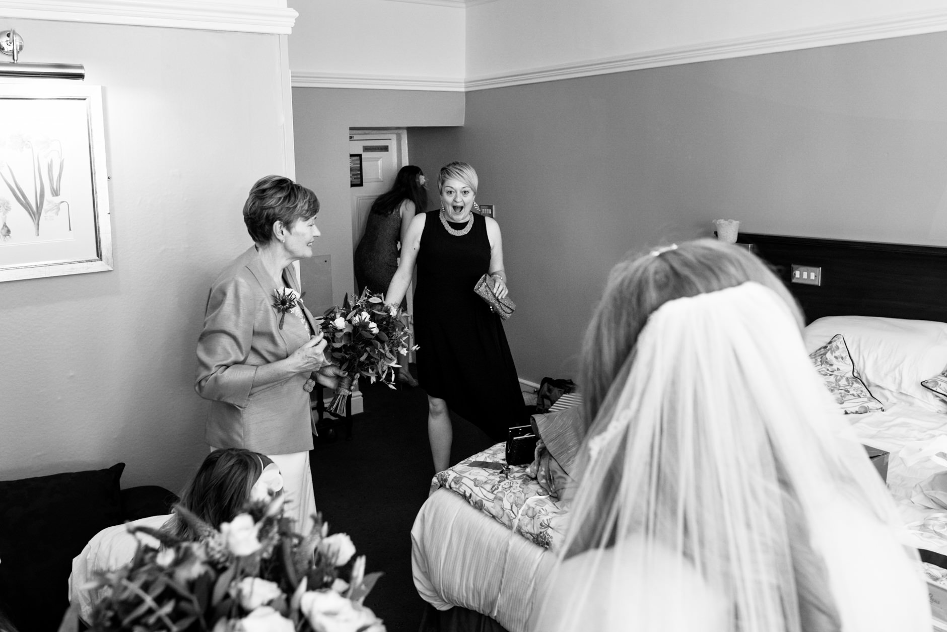 bride's friend sees her in her dress for the first time