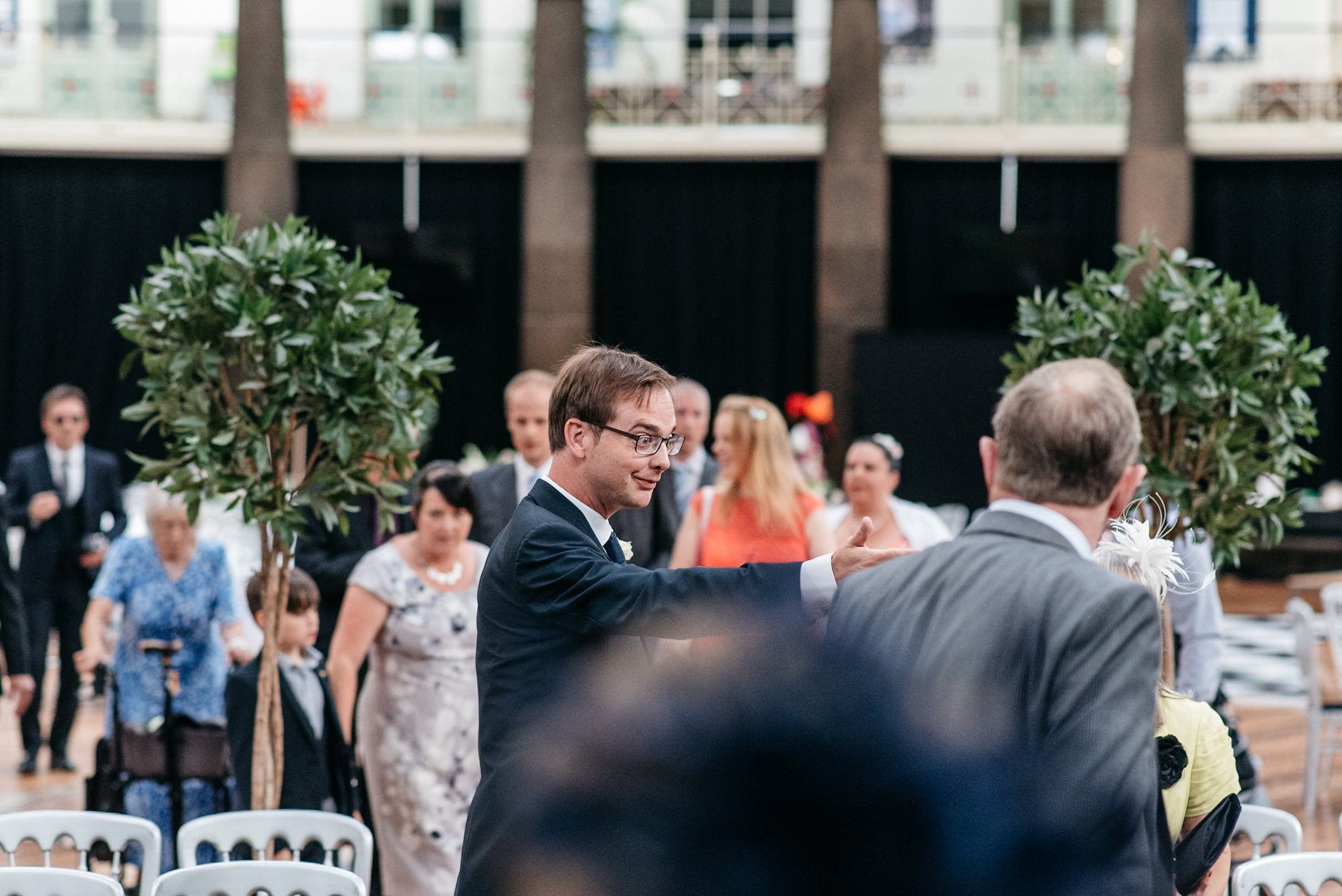 usher directing people to their seats