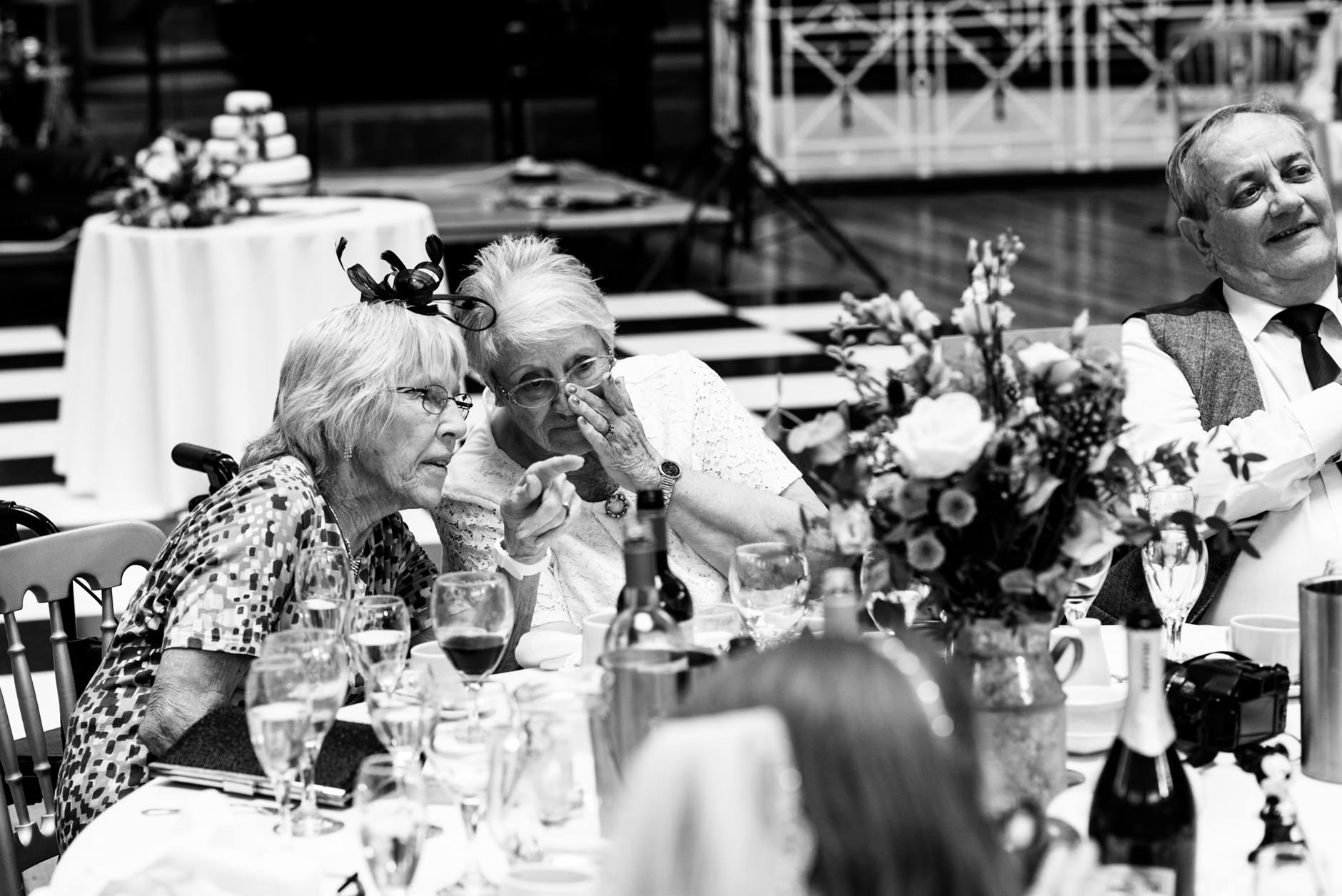 women having a whisper during the speeches