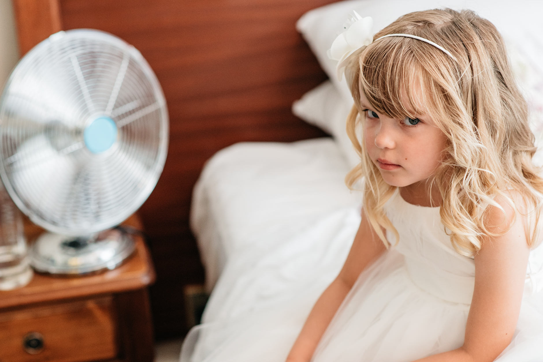 unhappy looking flower girl