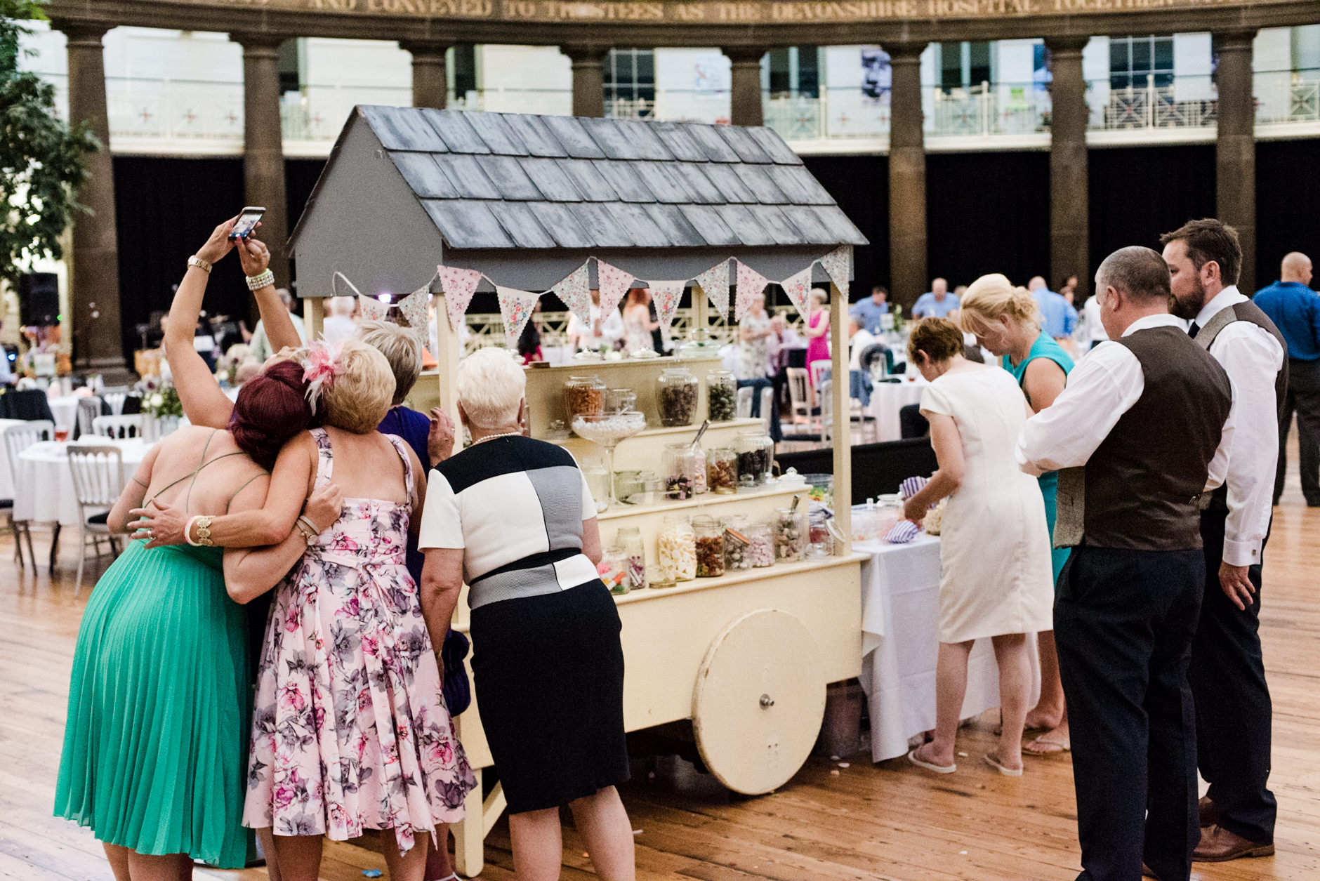 group selfie by the sweet cart