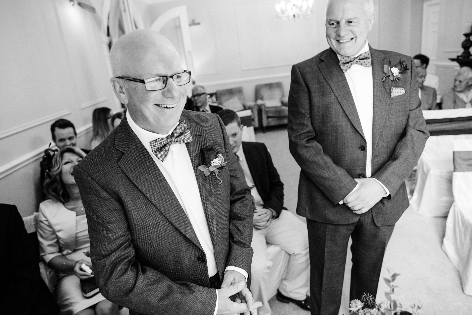 groom and best man sharing a joke