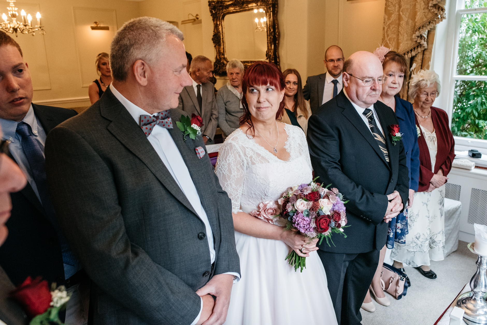 bride looks at her groom before the ceremony