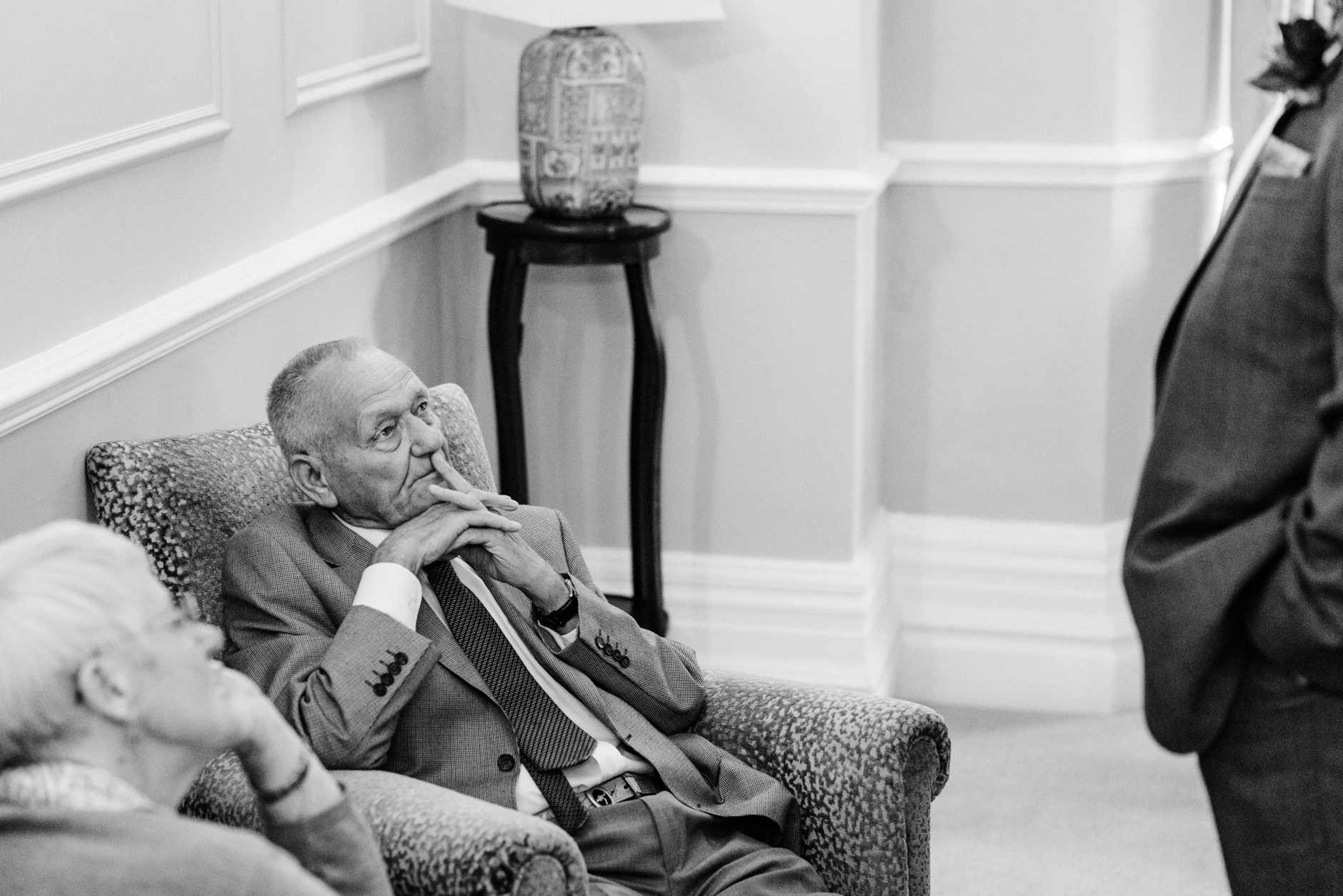 elderly wedding guest listening