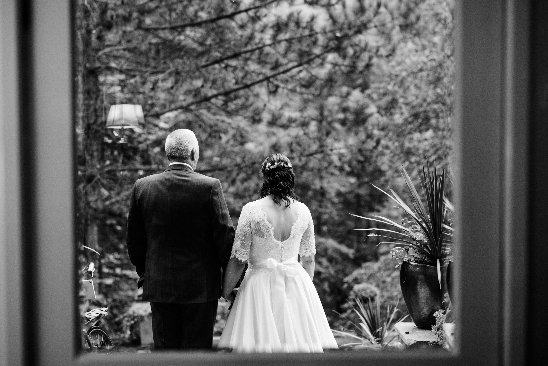 bride and groom from behind having a quiet moment