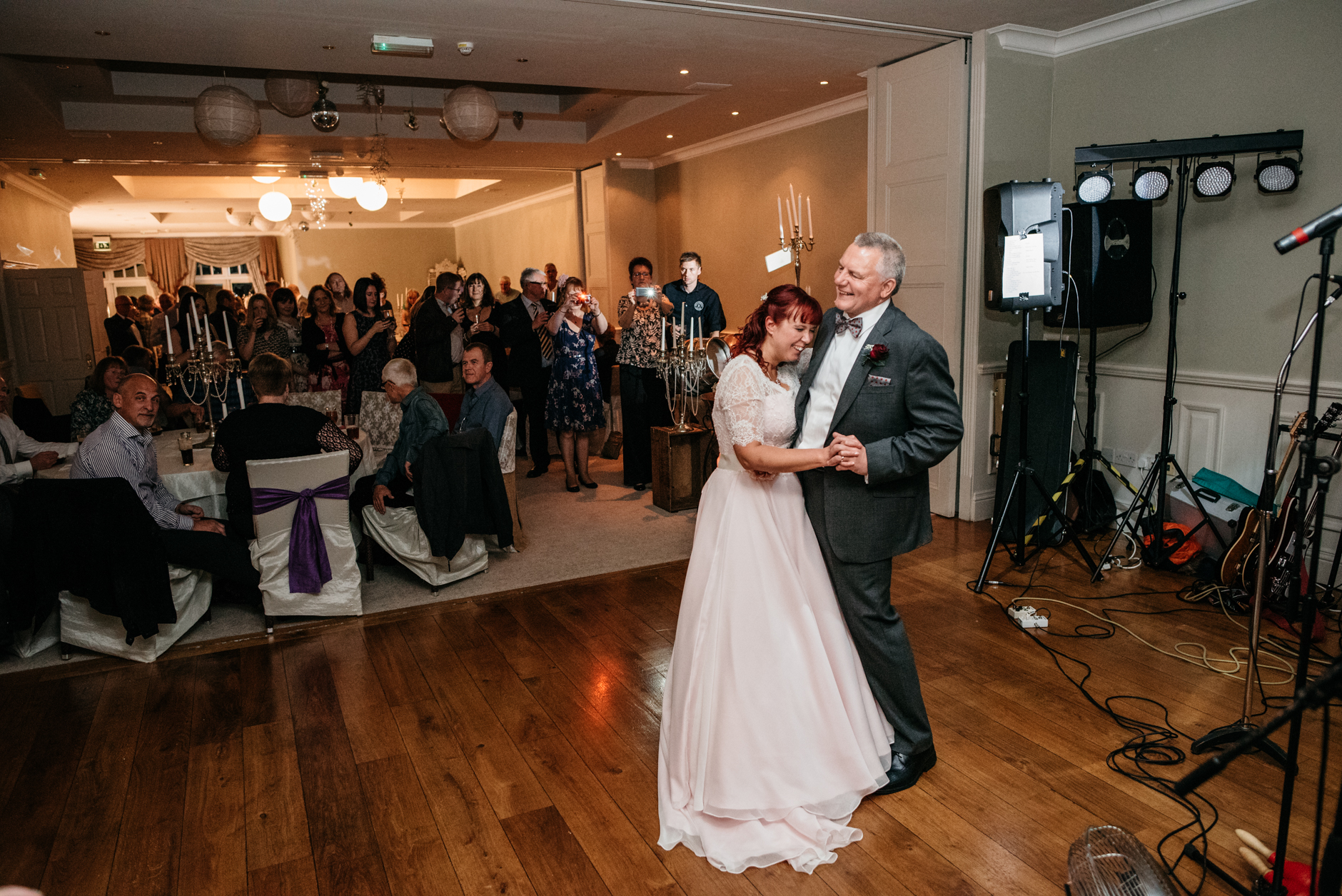 laughing during their first dance