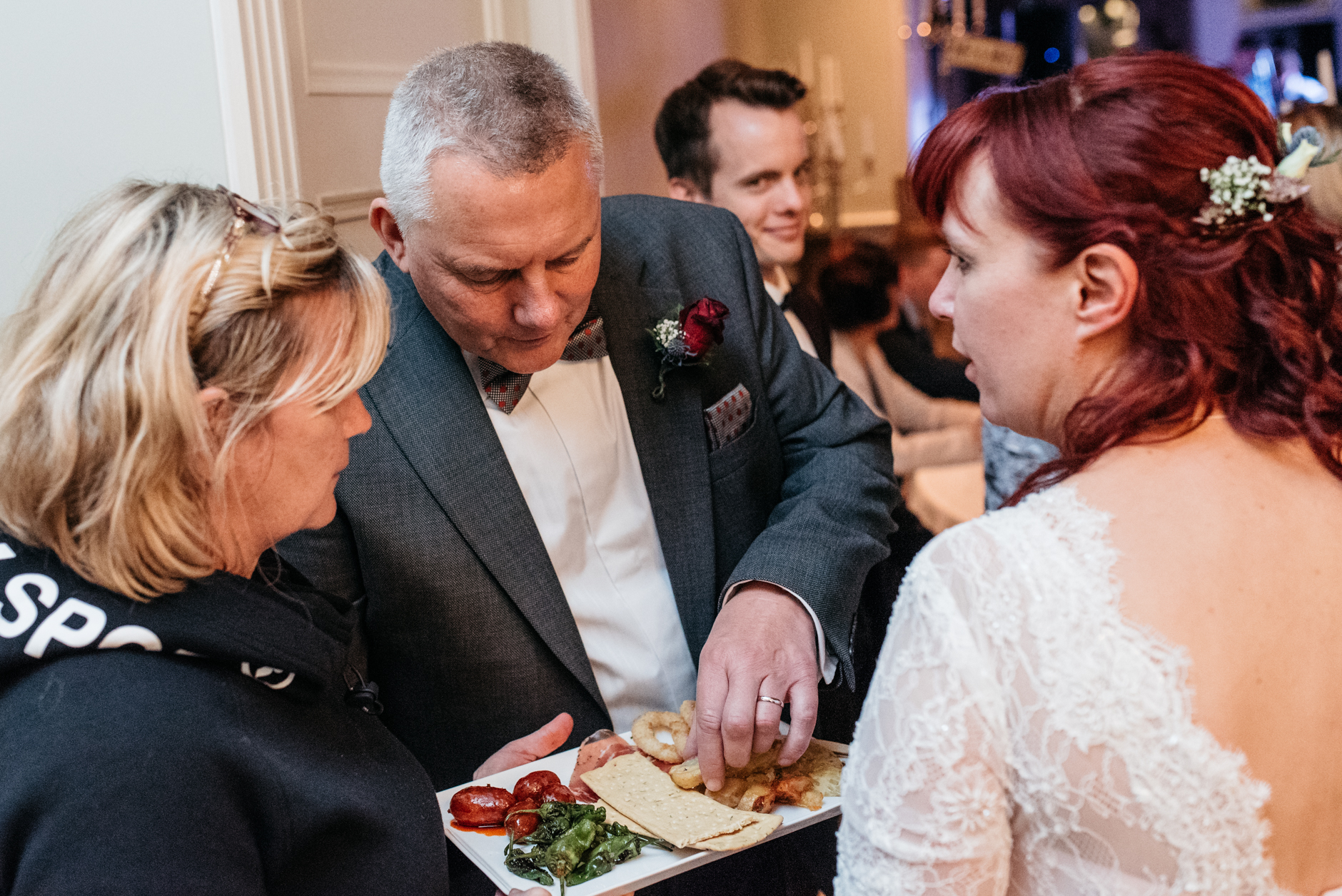 groom grabbing a quick snack