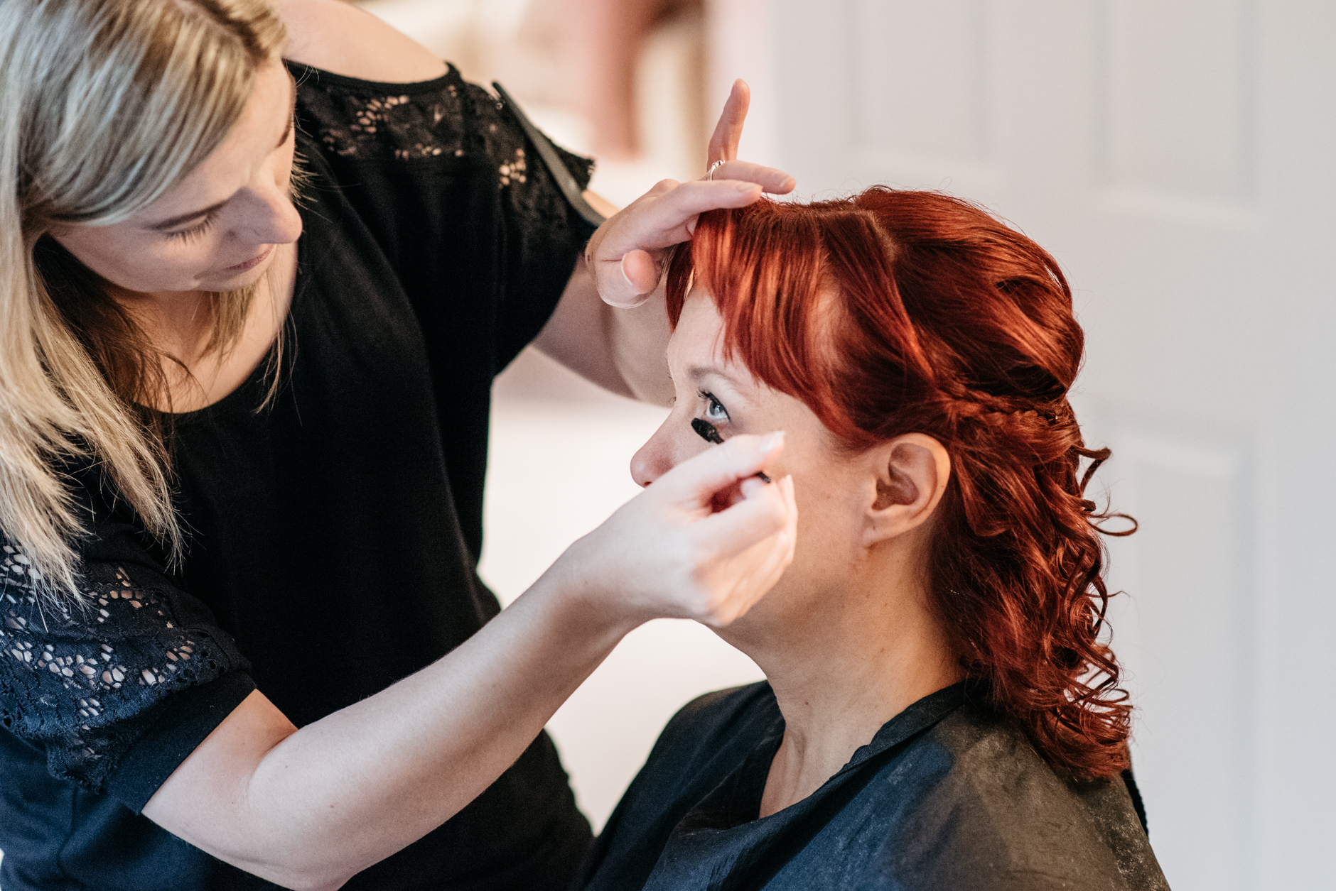 make up artist applying eye shadow