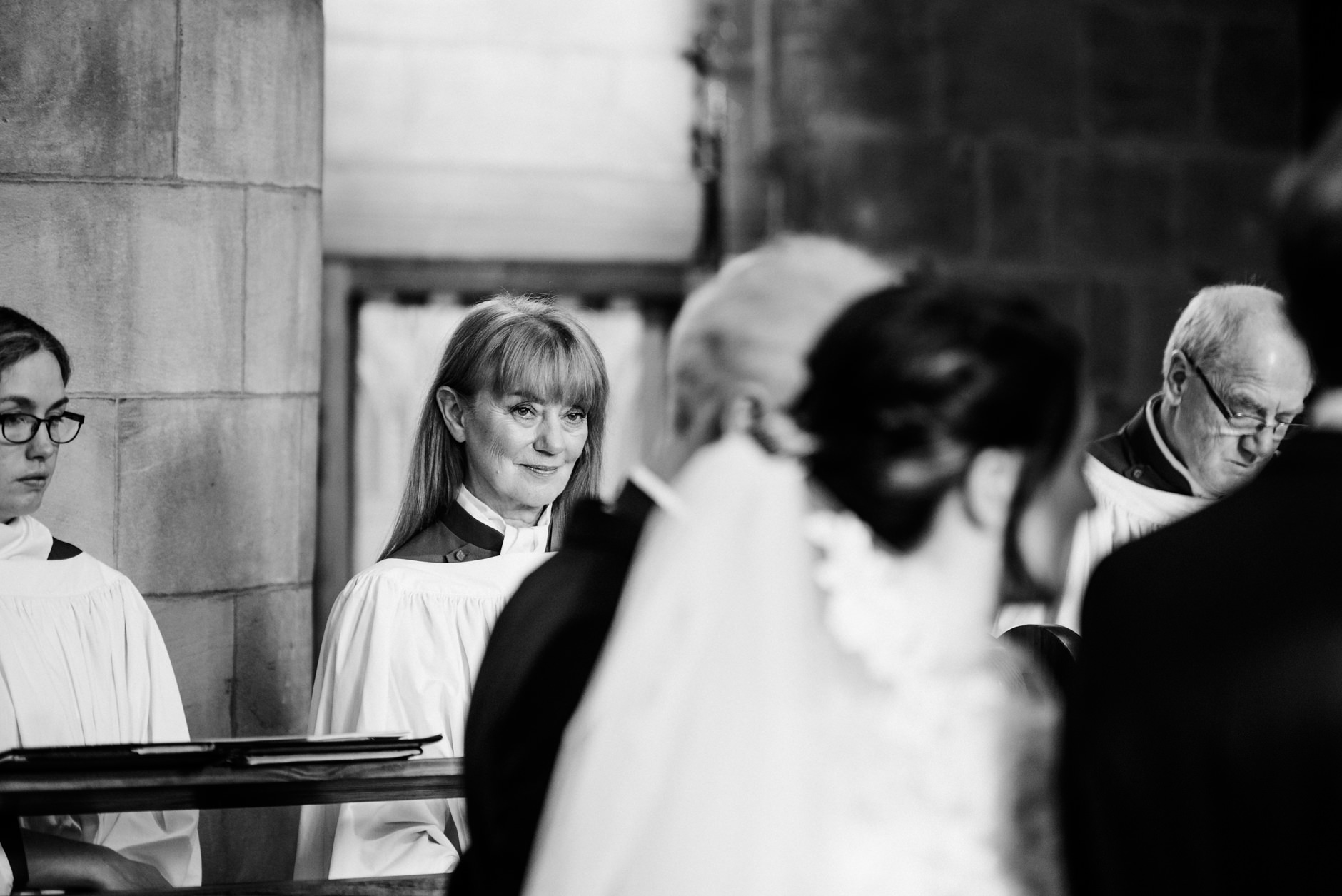 Member of the choir looking at the bride