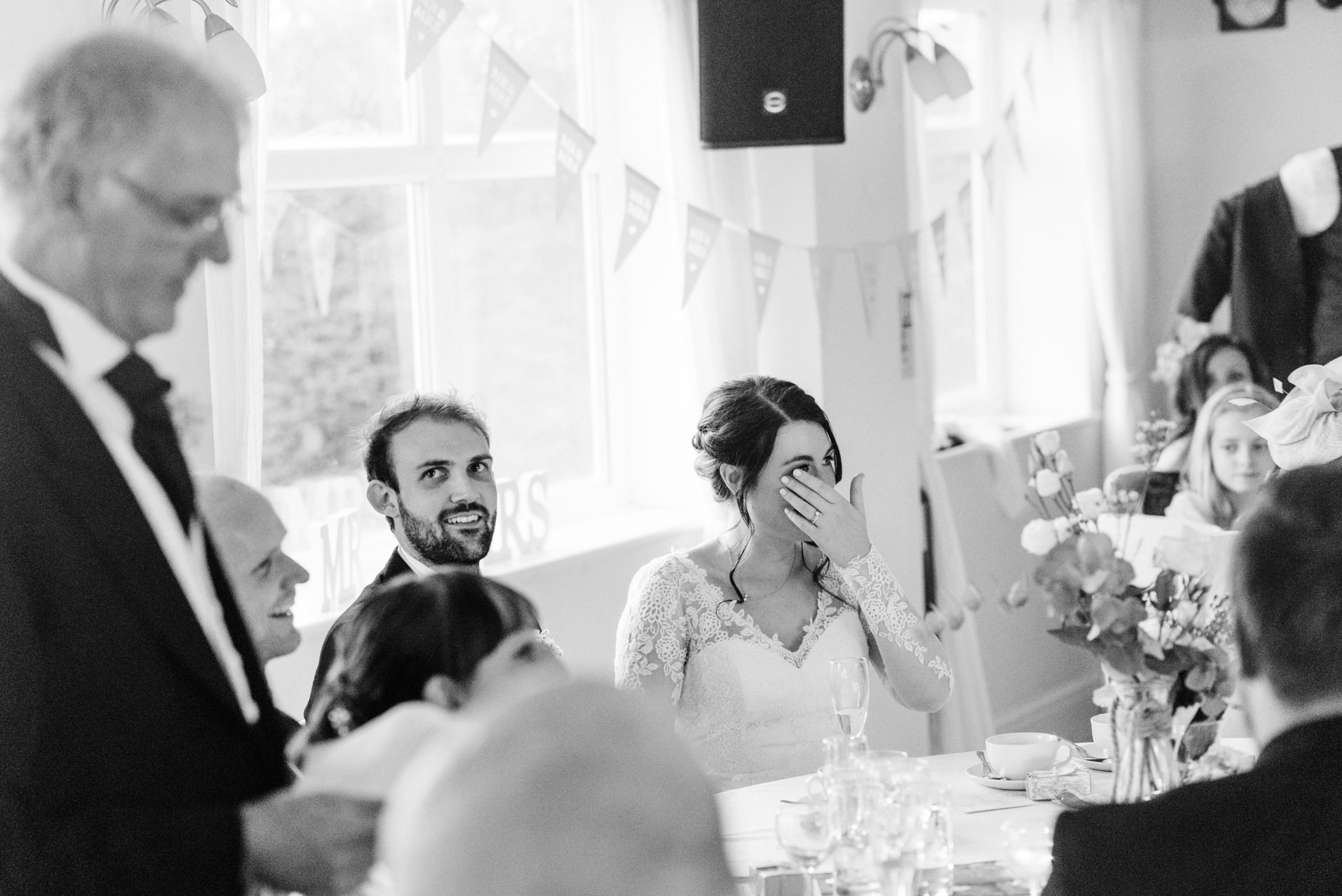 Bride wipes her eyes during her dad's speech