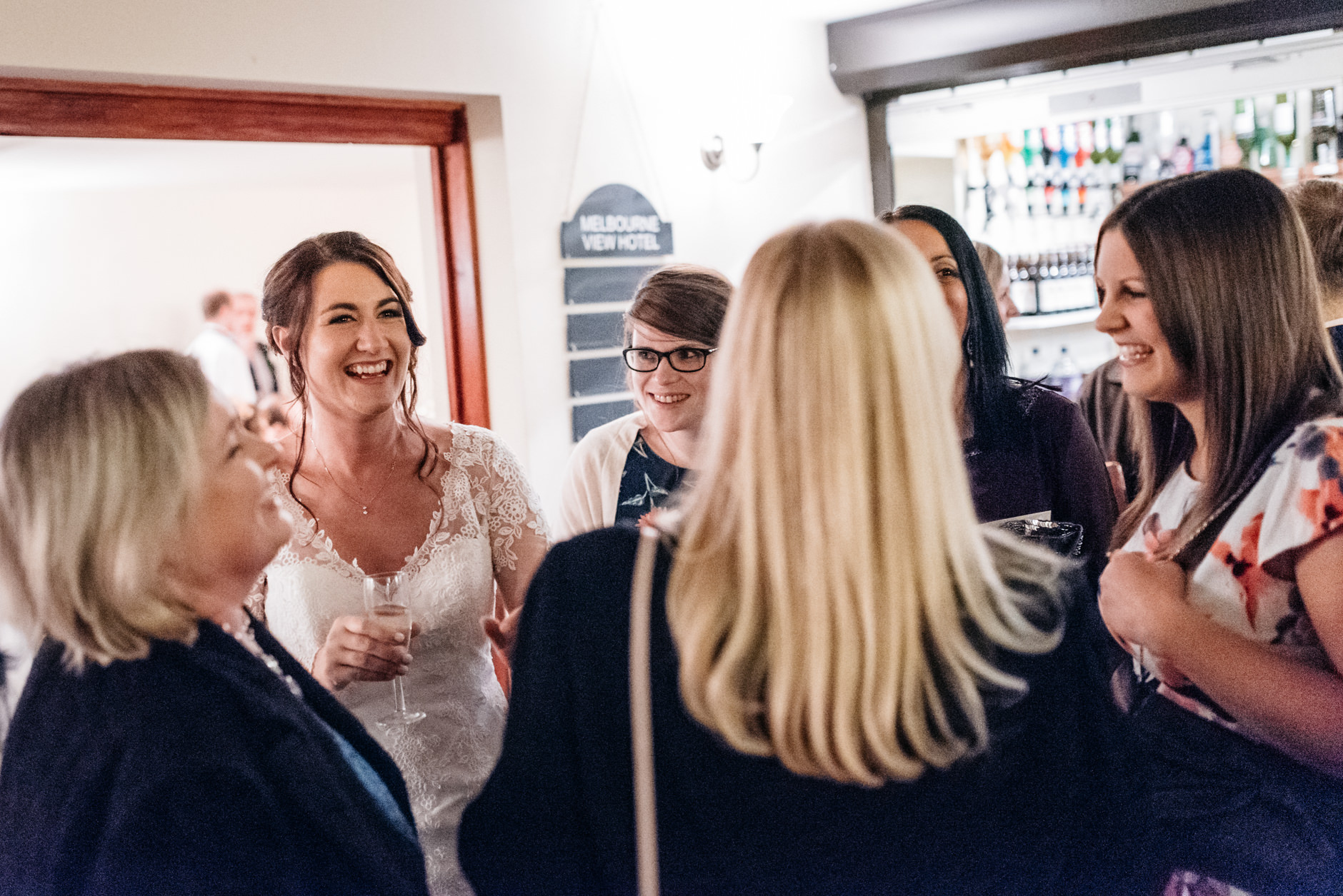 Bride greeting her friends at the evening reception