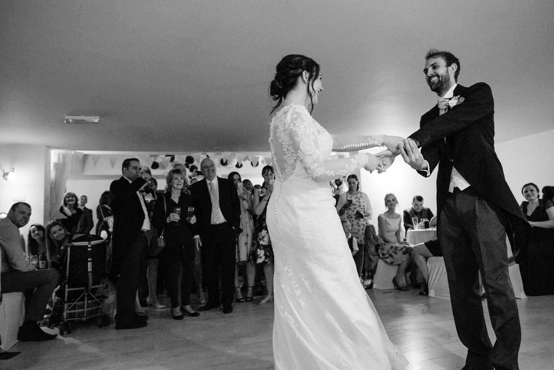 Couple smiling as they have their first dance