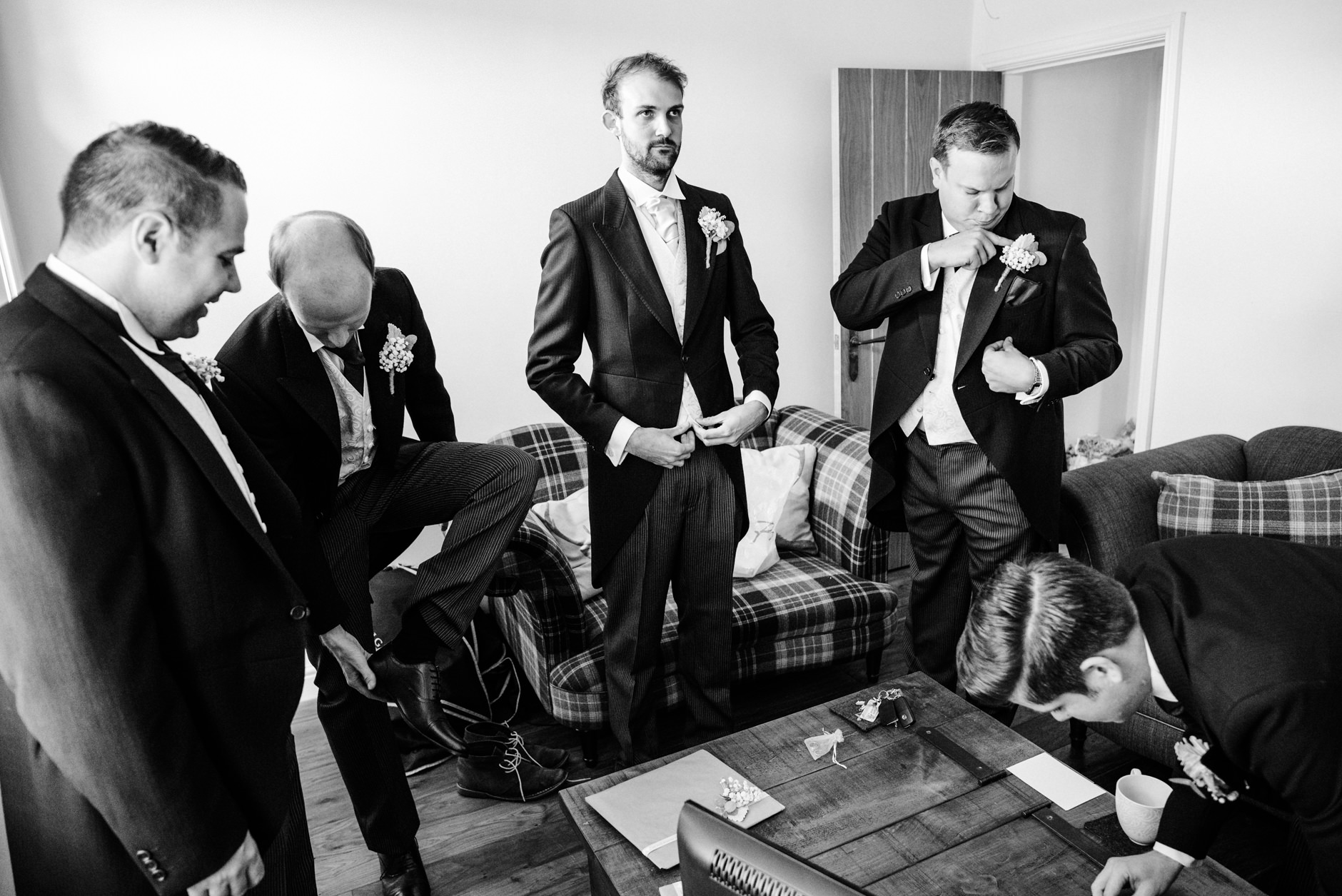 Groom and groomsmen getting ready to leave the house