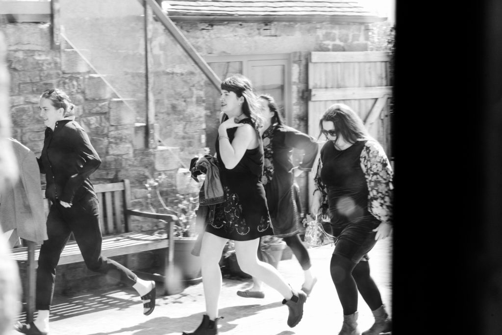 late wedding guests running