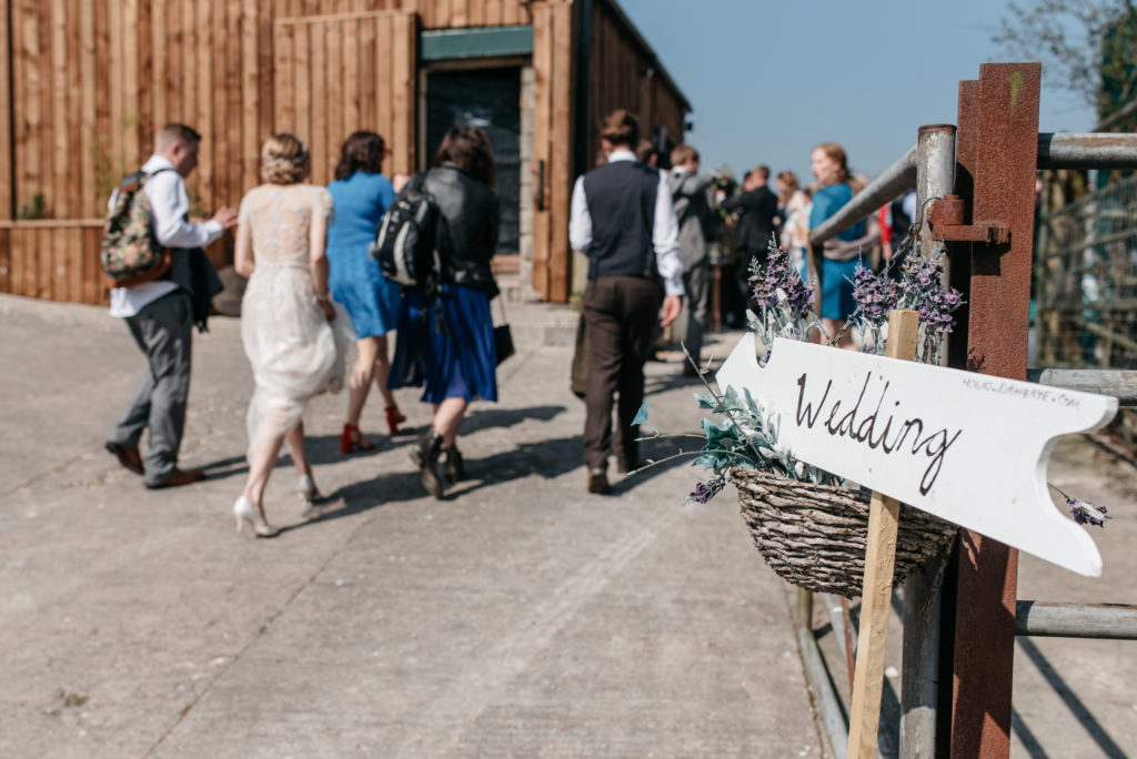 wedding sign pointing to the venue