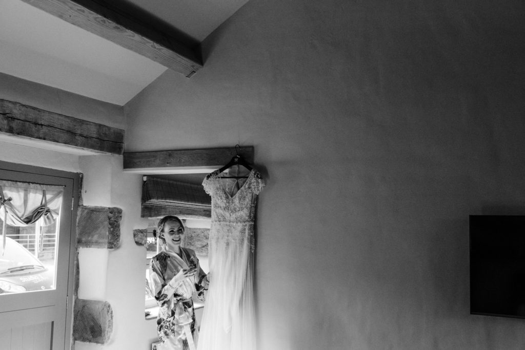 bride looking at her wedding dress