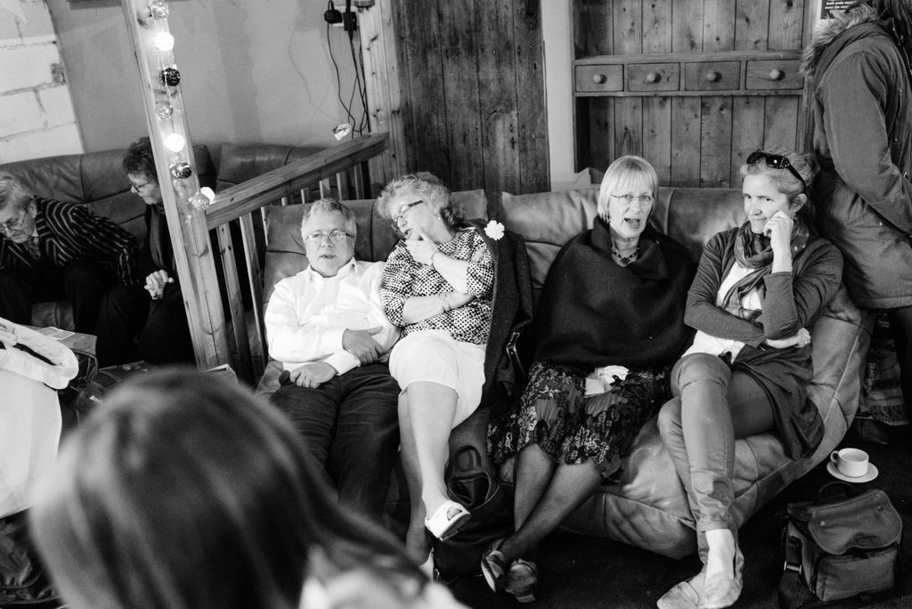 guests chatting on a sofa